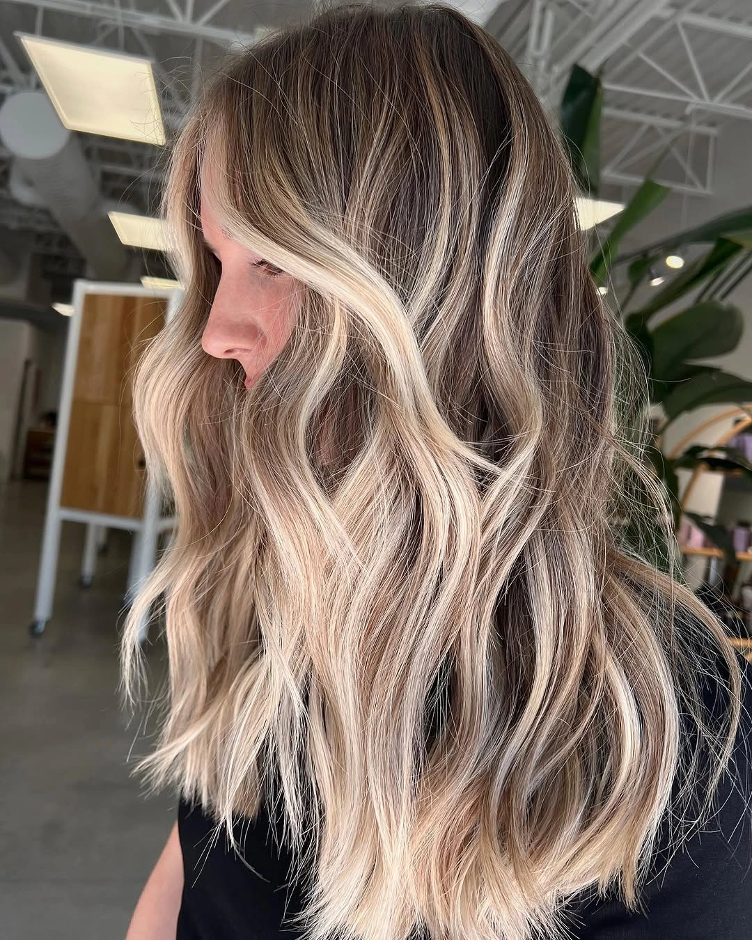hair lowlights color ideas and inspiration Smoky Bronde Lengths With Bright Money Pieces
