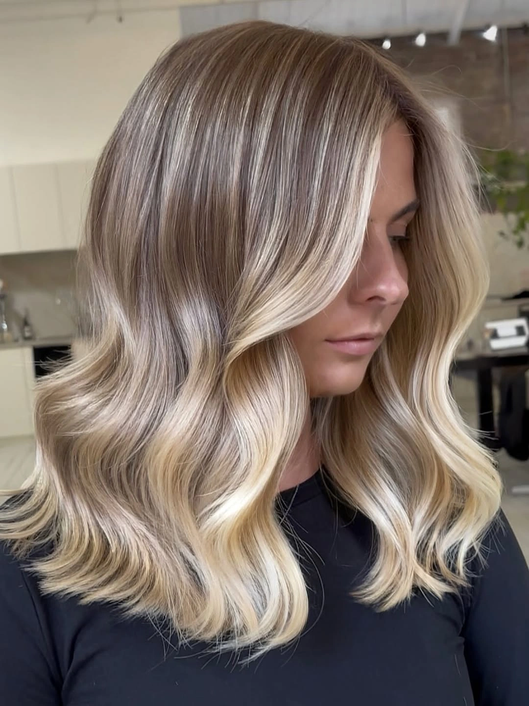 hair lowlights color ideas and inspiration Cool Blonde Waves With a Taupe Shadow Root
