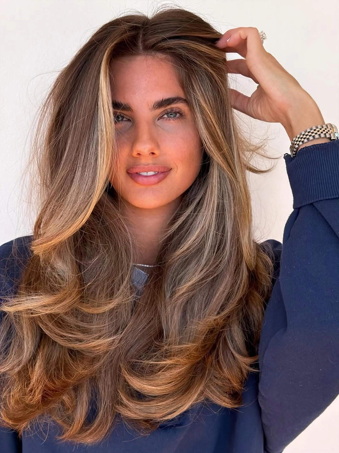 hair lowlights color ideas and inspiration Caramel Brunette Butterfly Layers