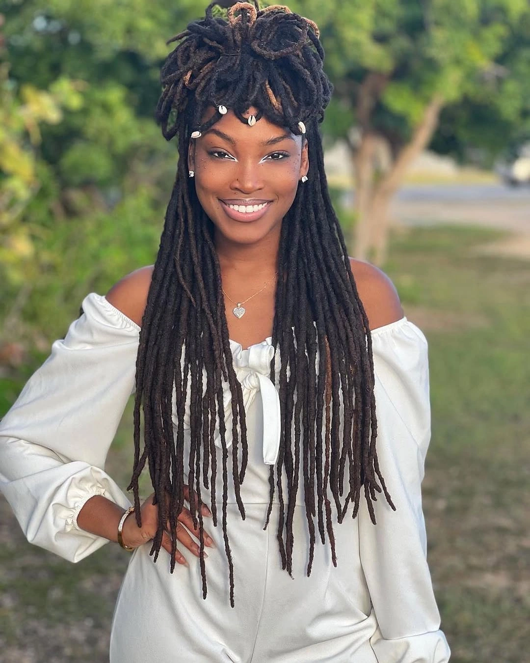 locs hairstyles for black women Long Locs With Shells And A Half-Up Crown
