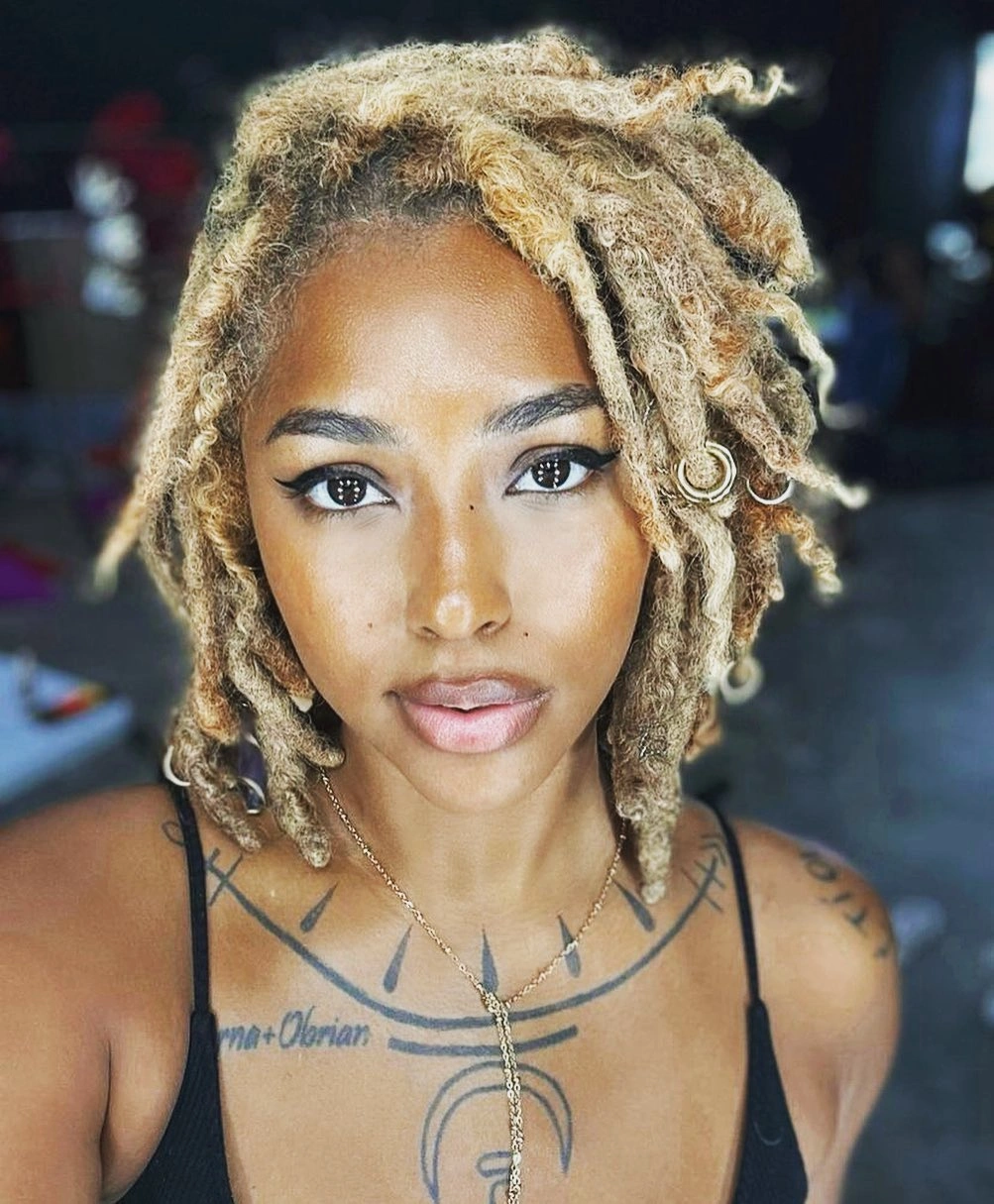 locs hairstyles for black women Short Blonde Locs With A Soft Side Sweep