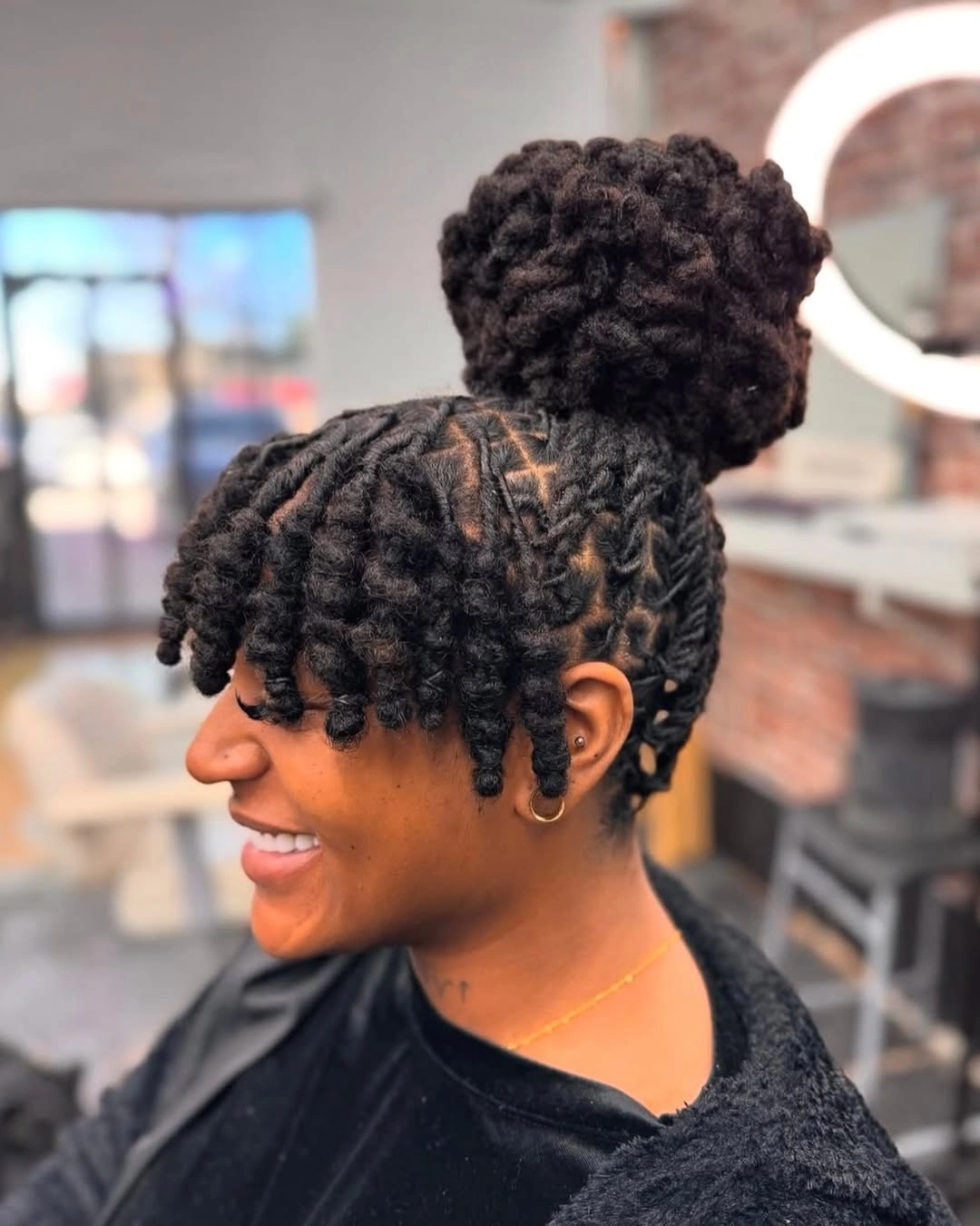 locs hairstyles for black women High Bun Locs With Soft Fringe Pieces