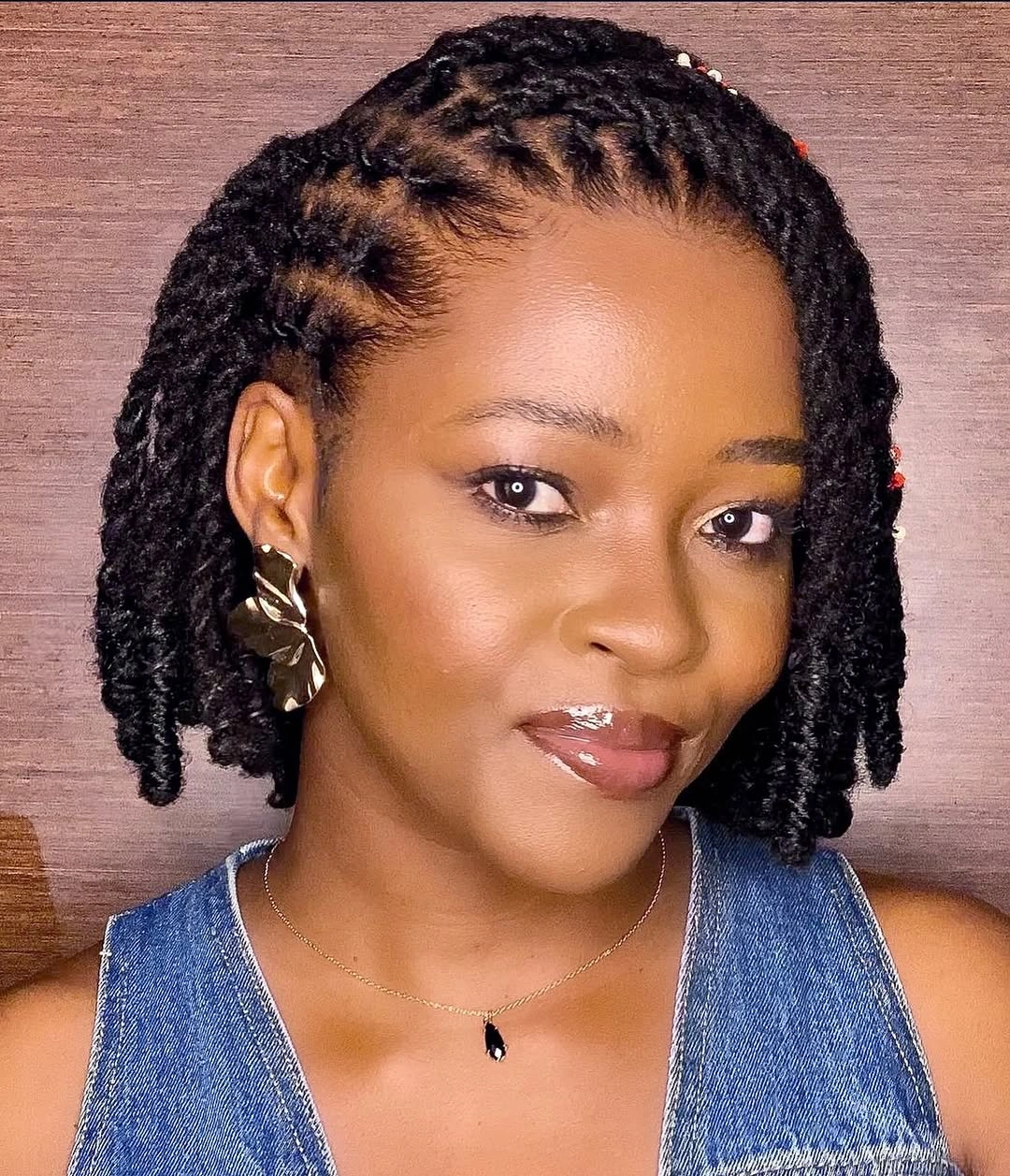 locs hairstyles for black women Side-Swept Bob Locs With Glossy Minimal Glam