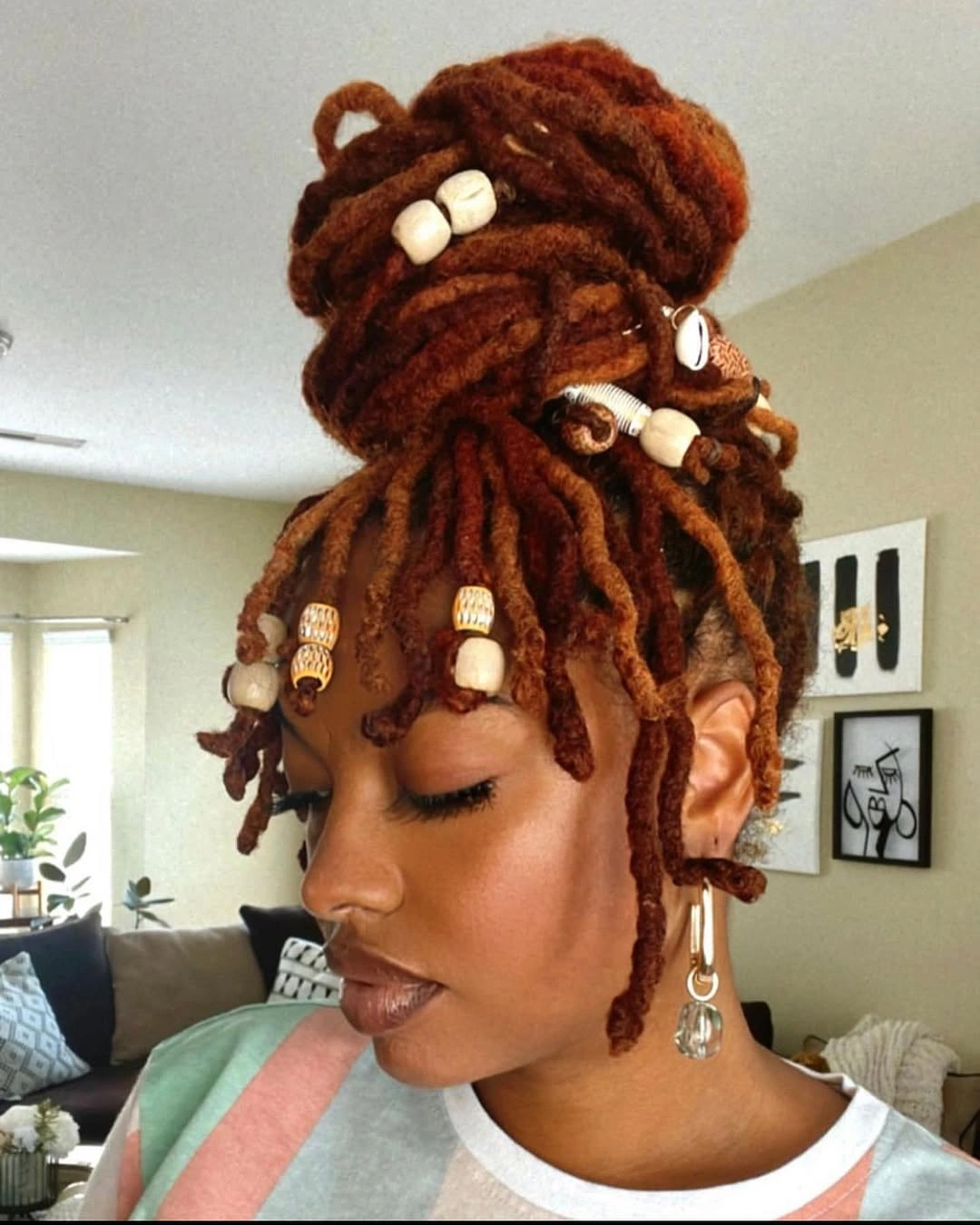 locs hairstyles for black women Ginger Loc Bun With Beads And Shell Accents