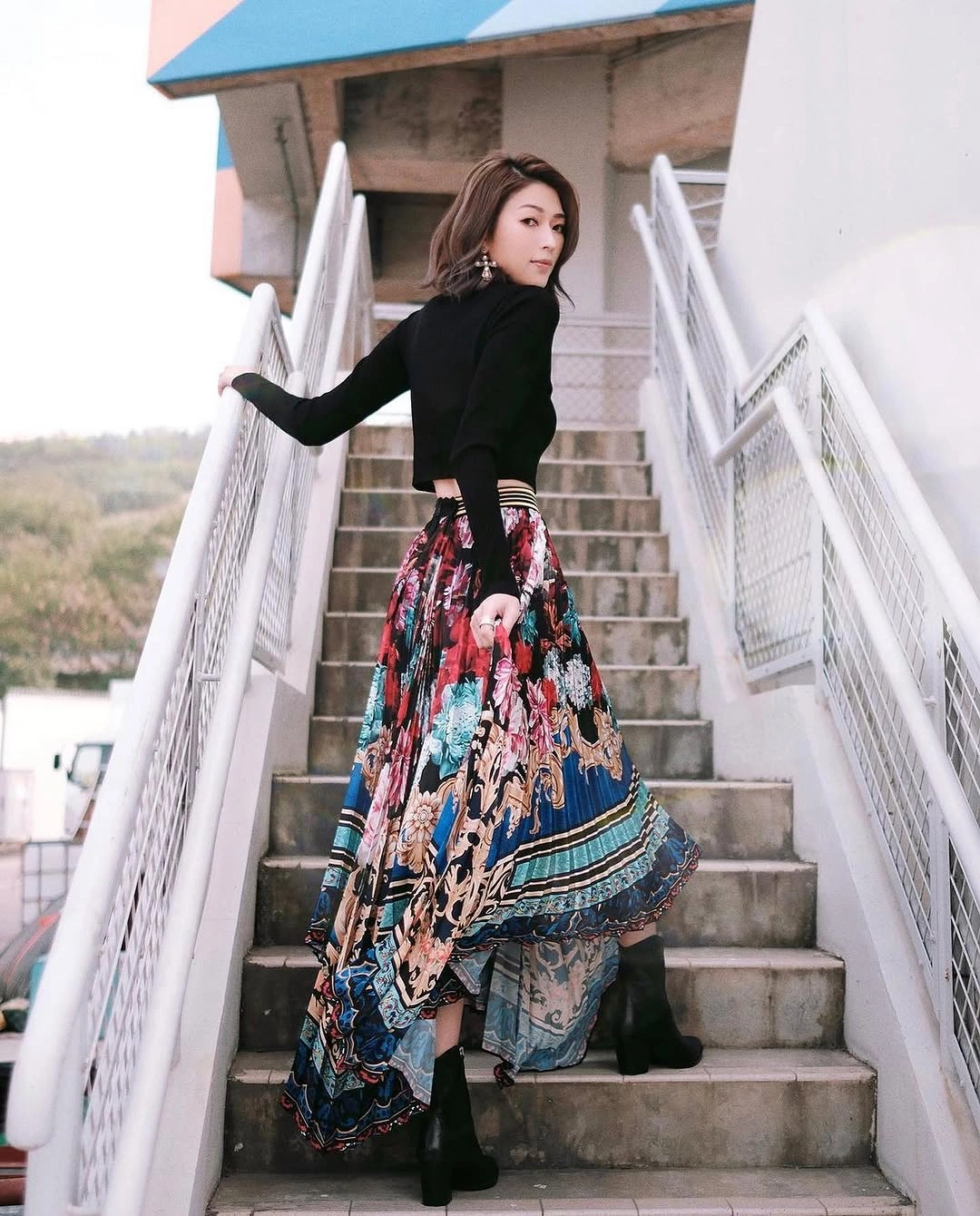 midi skirt fall outfit 2026 + Black Knit and Dramatic Floral High-Low Midi Skirt