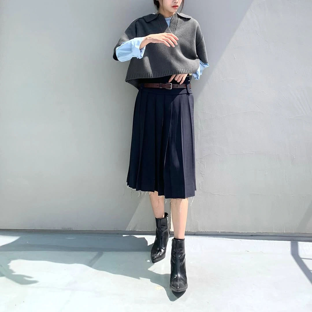 midi skirt fall outfit 2026 + Grey Knit Layers With a Black Pleated Midi