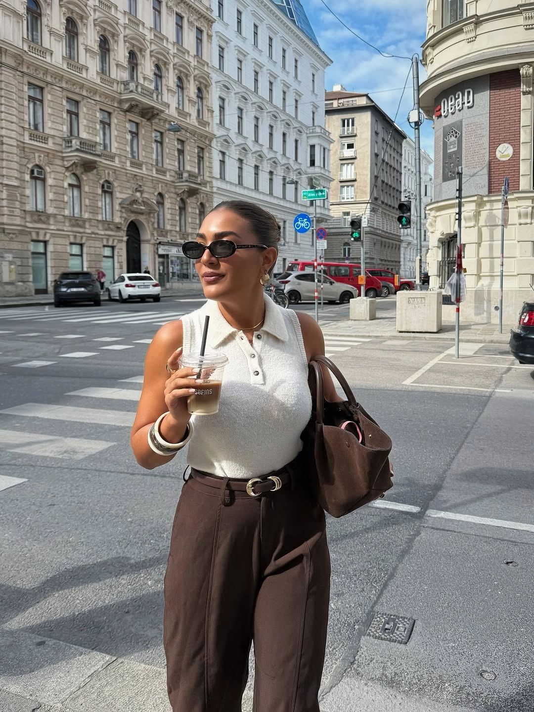 september fashion trends 2026 Sleeveless Knit With Belted Brown Trousers