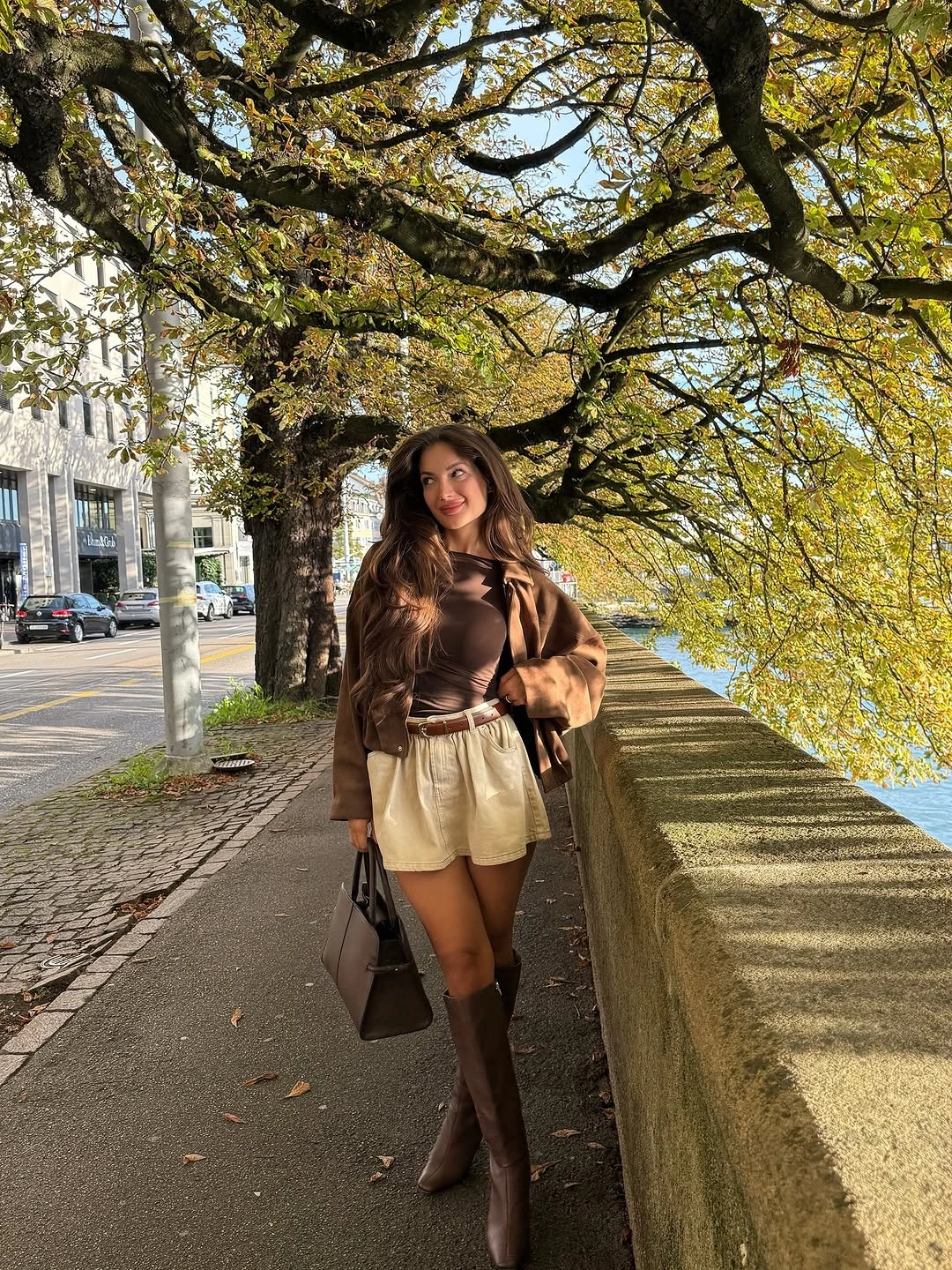 september fashion trends 2026 Brown Mini Shorts With Tall Matching Boots