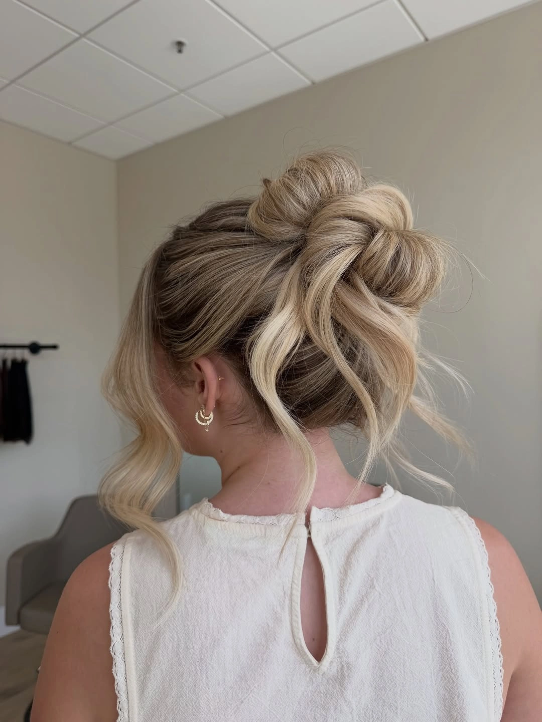 september hairstyles ideas 2026 Blonde Messy Bun With Long Ribbon-Like Ends