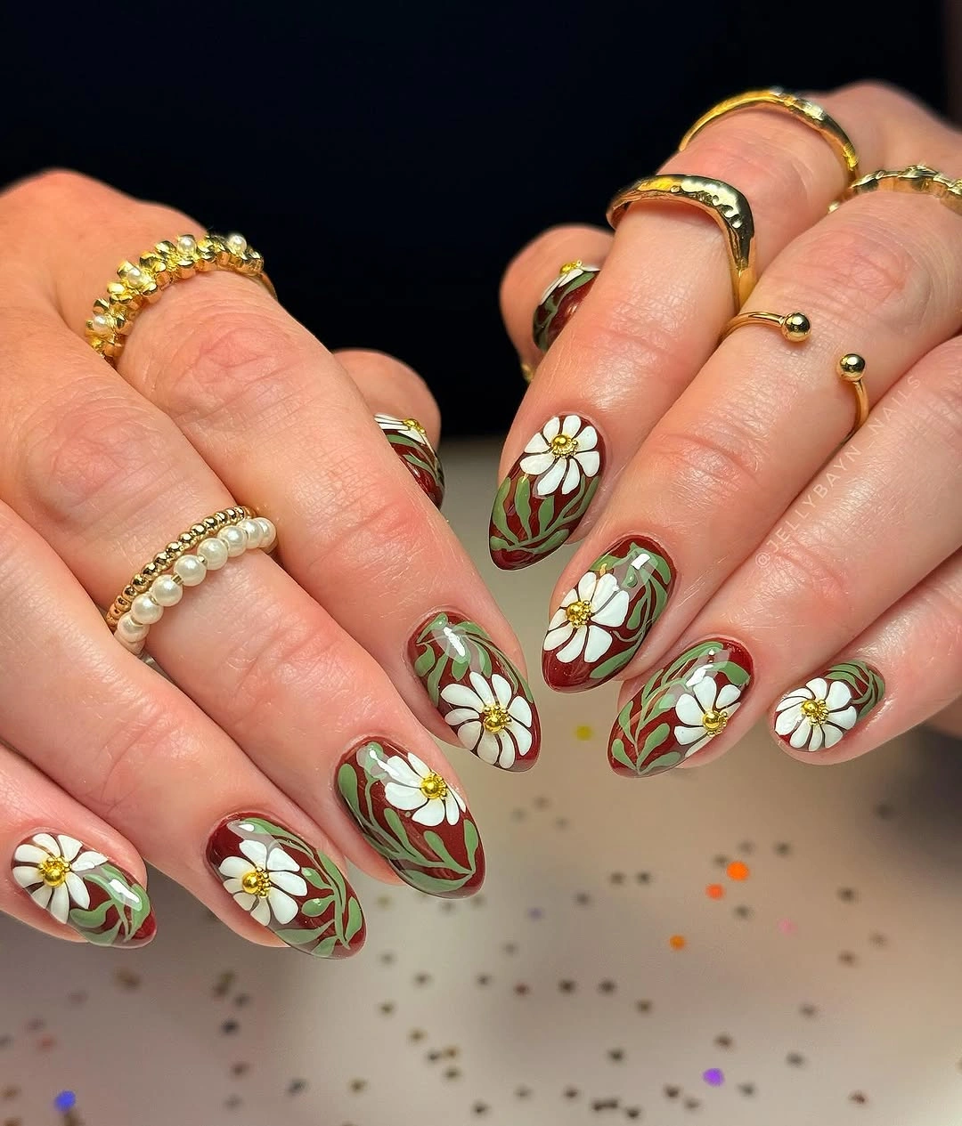 september nail art ideas 2026 White Daisy Almond Nails with Green Vines