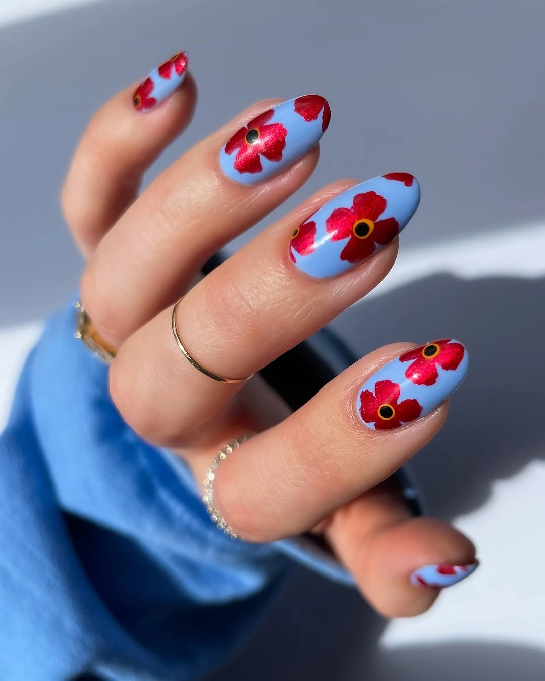 september nail art ideas 2026 Baby Blue Almond Nails with Red Flowers