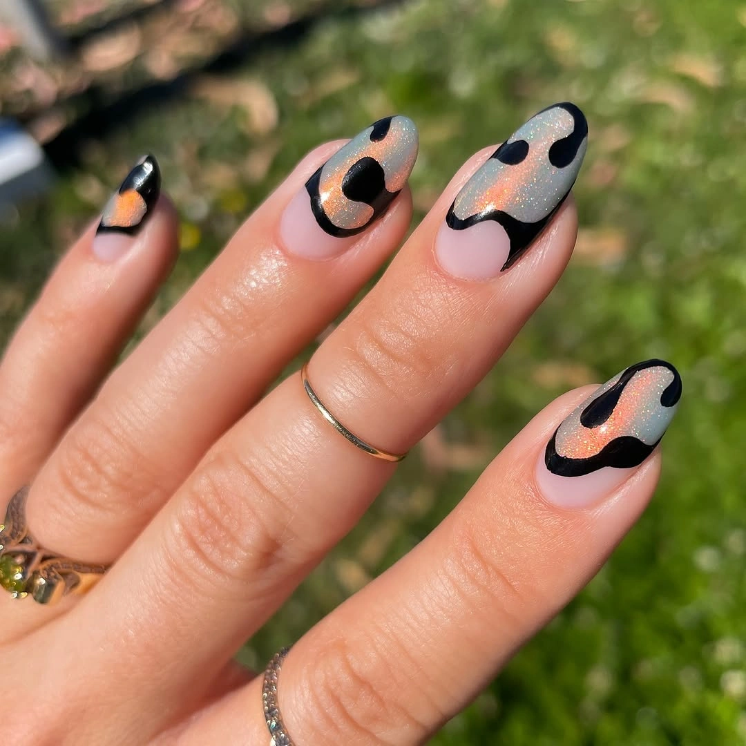 september nail art ideas 2026 Nude Almond Nails with Black Cow Print