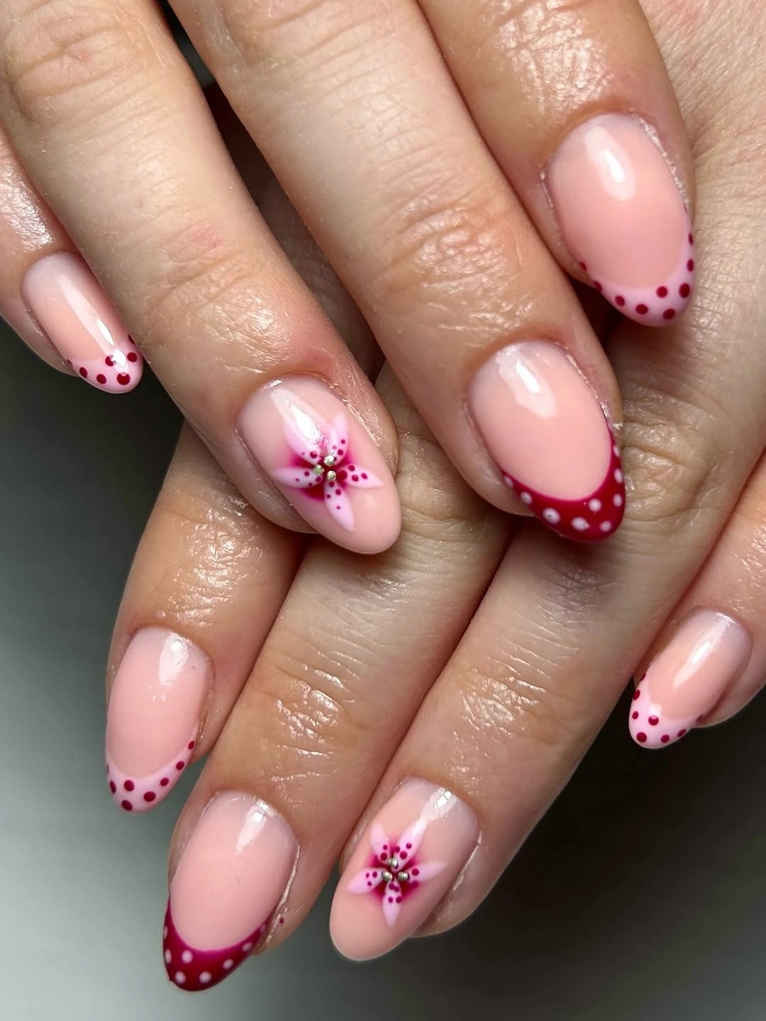 september nail art ideas 2026 Red Dotted French Tips with Pink Flowers