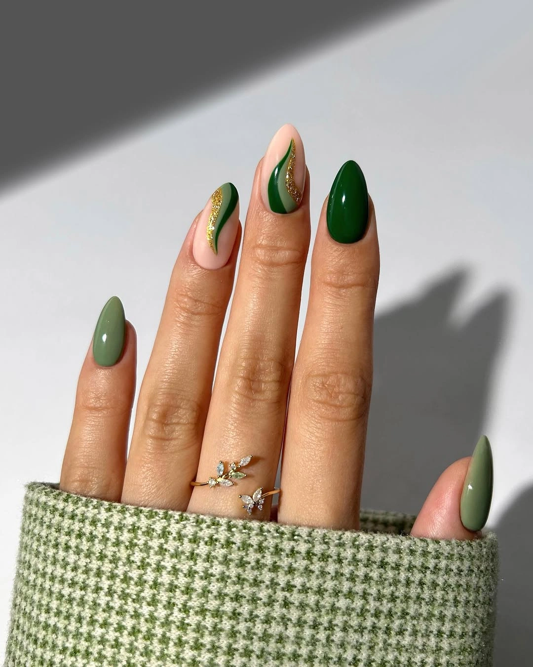september nail art ideas 2026 Green Almond Skittle Nails with Leaf Accent