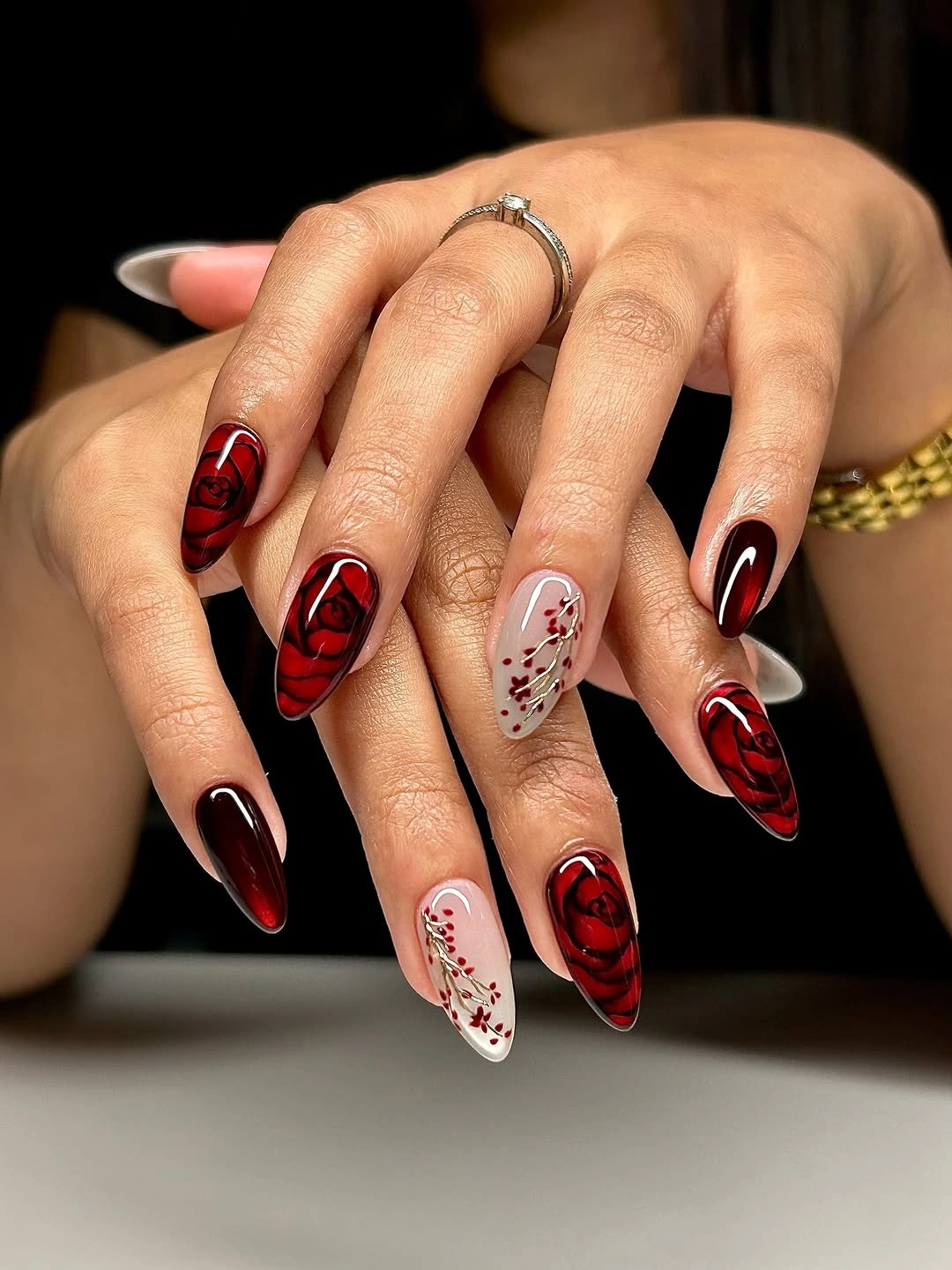 september nail art ideas 2026 Black and Red Almond Nails with Rose Graphics