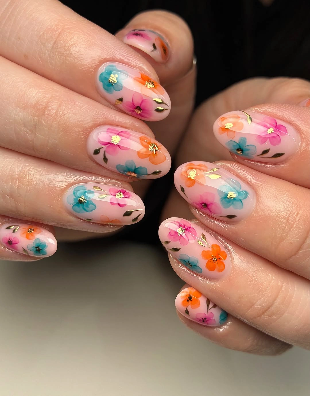 september nail art ideas 2026 Multicolor Floral Art on Sheer Oval Nails