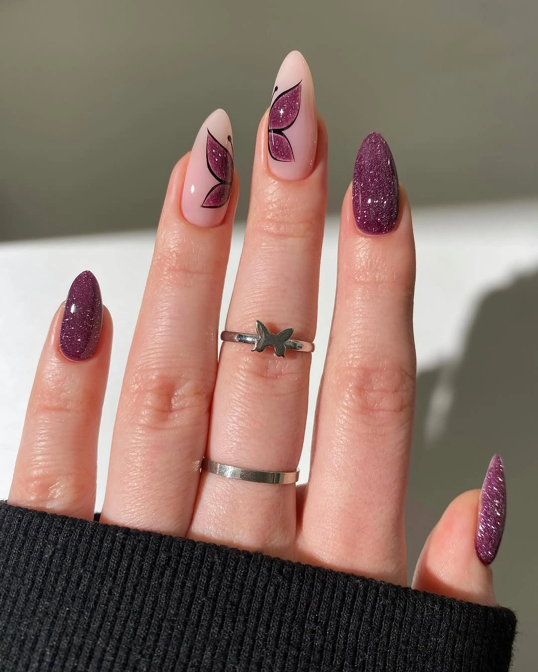september nail designs 2026 Purple Glitter Almond Nails with Cutout Accents