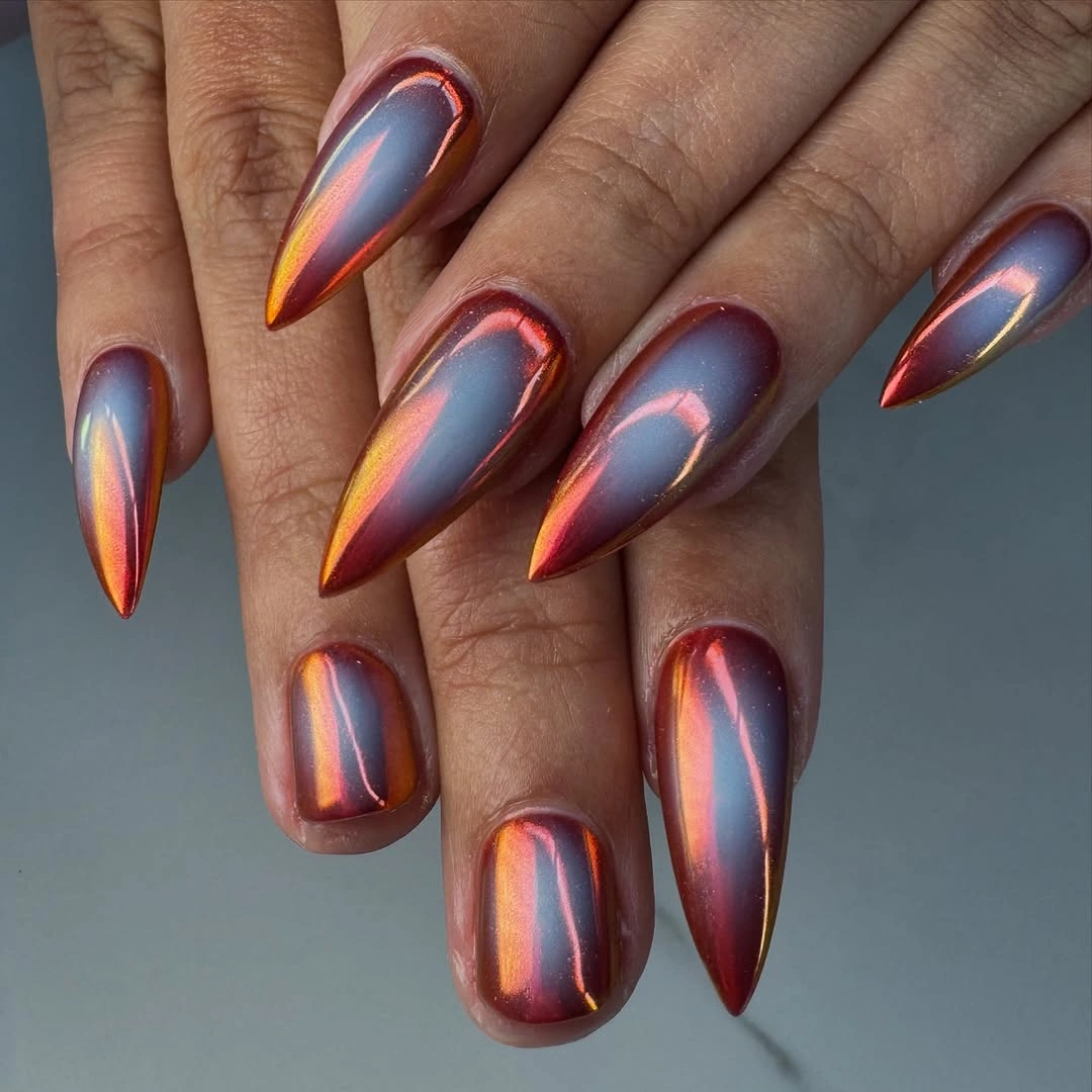 september nail designs 2026 Copper Chrome Stiletto Nails with Blue Sheen