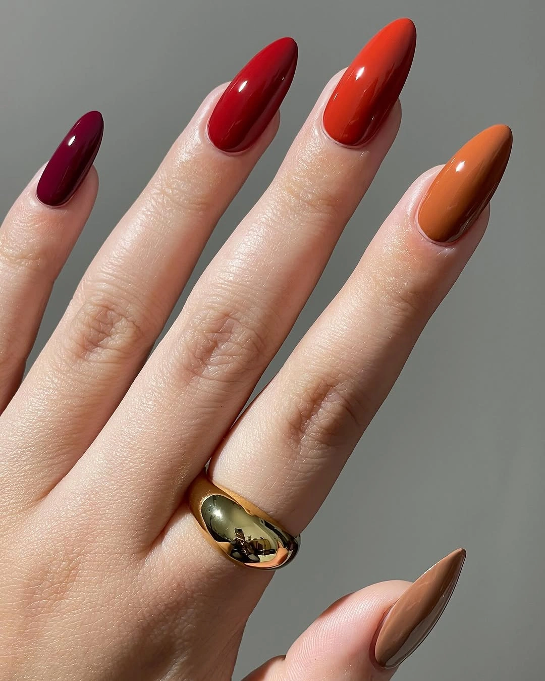 september nails color 2026 Burgundy, Red, Orange, and Caramel Almonds