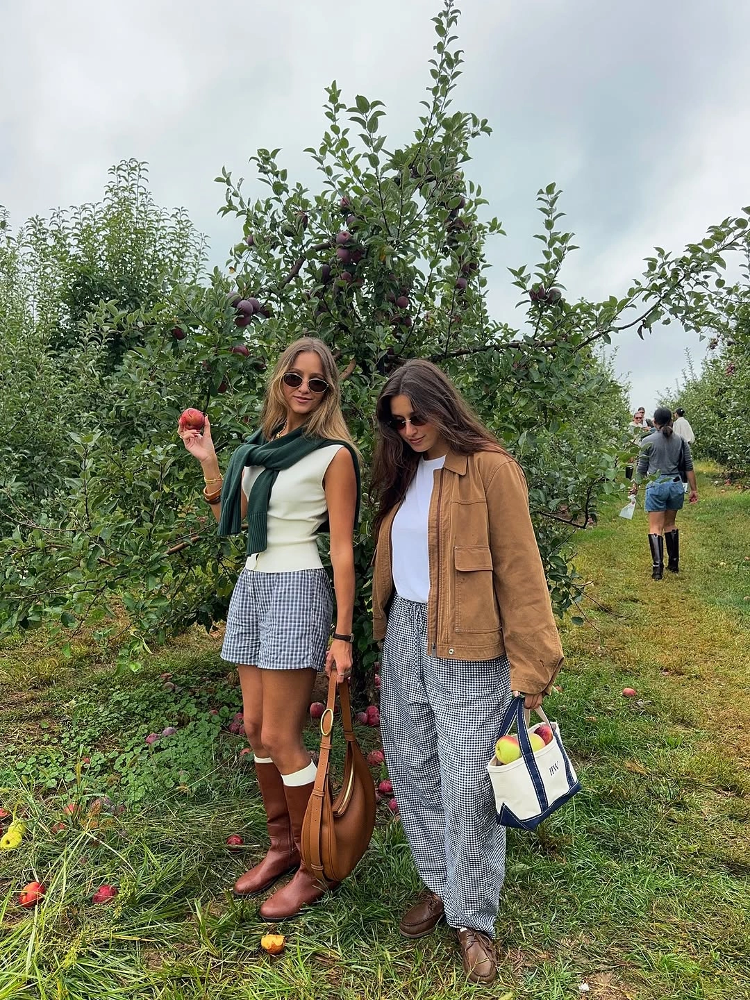 september outfits ideas 2026 Green Vest With Gray Shorts And Tall Boots