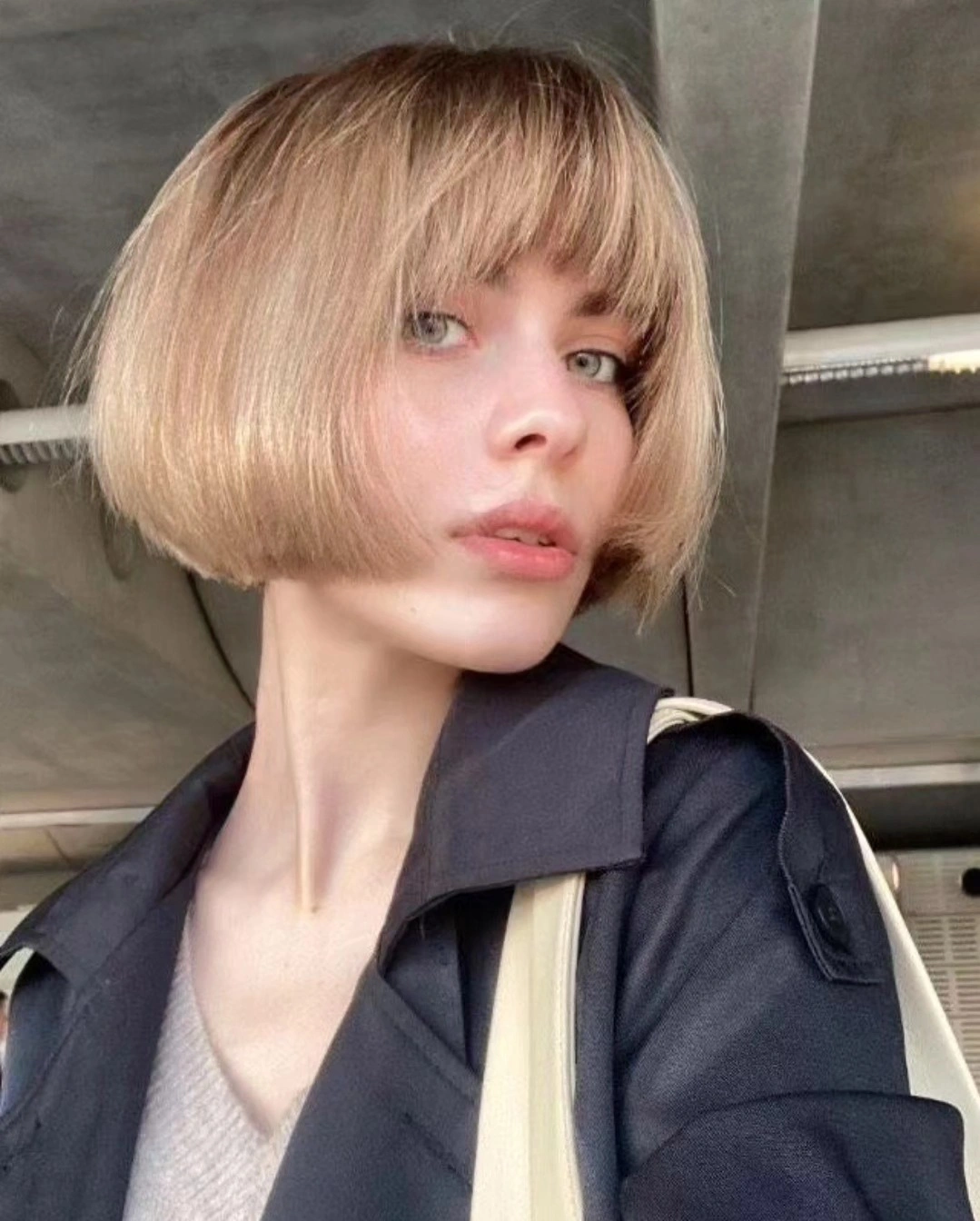 short bobbed hairstyle Soft Blonde Bob With a Curved Full Fringe