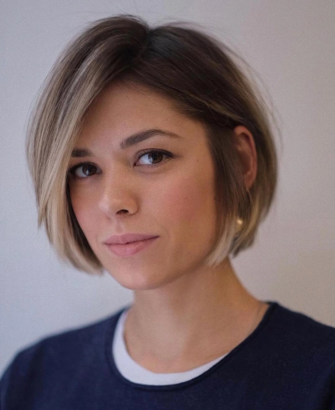 short bobbed hairstyle Asymmetrical Bronde Bob With One Side Tucked