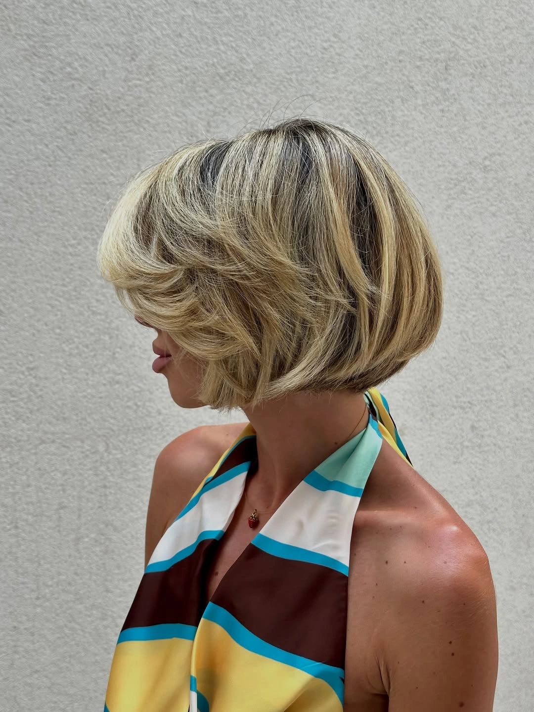 short bobbed hairstyle Rooted Blonde Bubble Bob With Stacked Layers