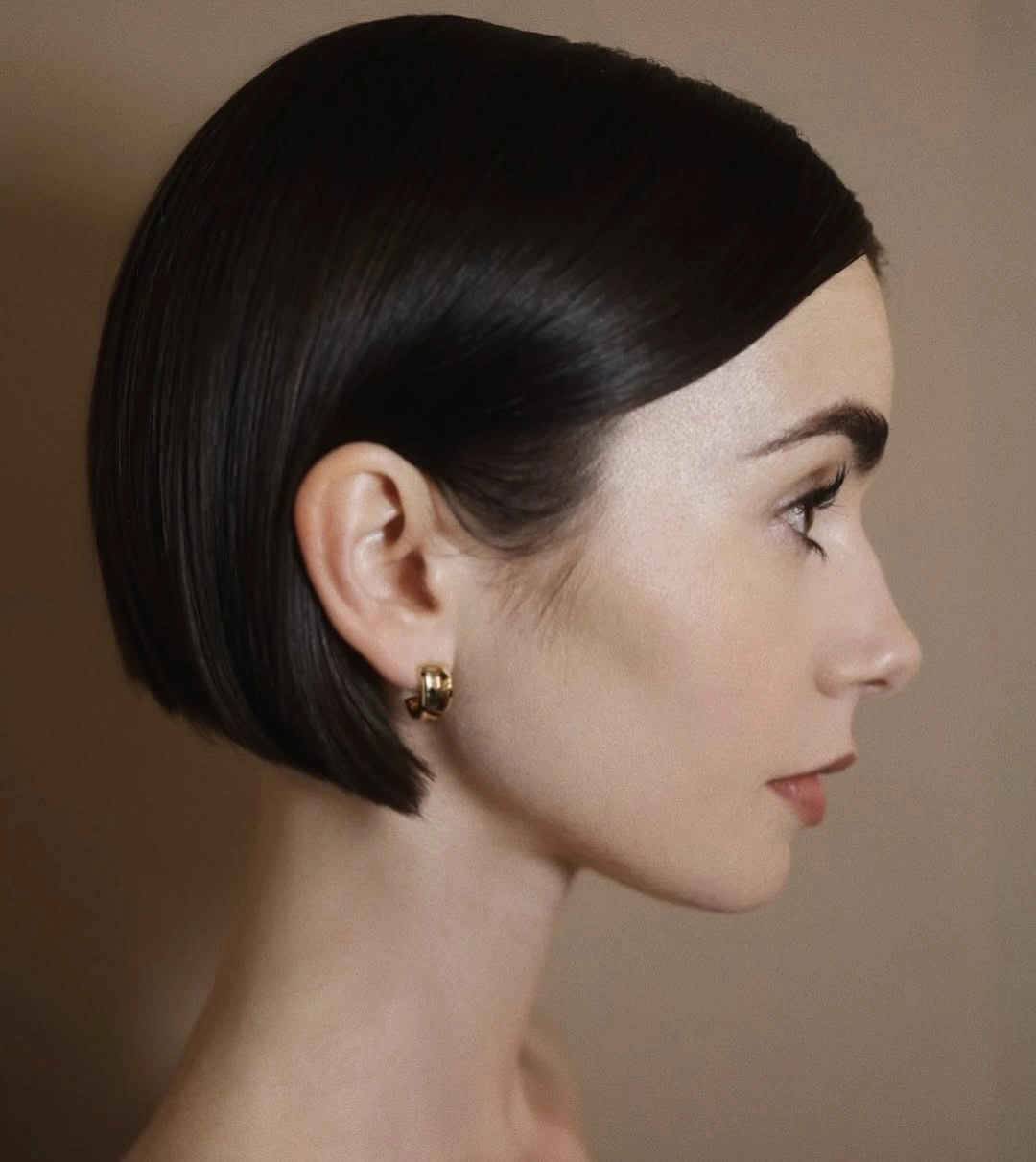 short bobbed hairstyle Glass-Black Bob Tucked Behind the Ear