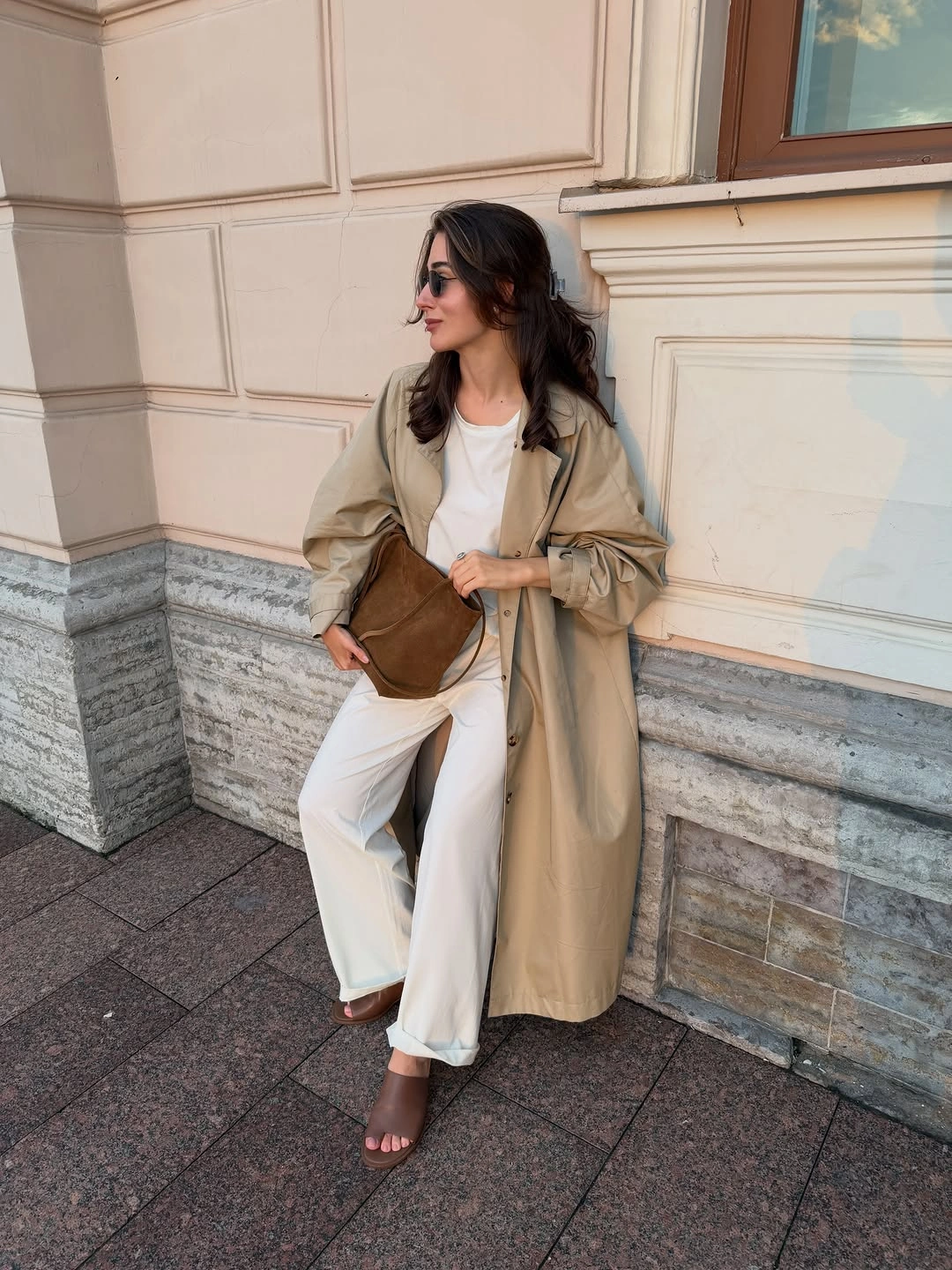 Trench coat fall outfits 2026 + Long Tan Trench With Cream Separates And A Brown Suede Bag
