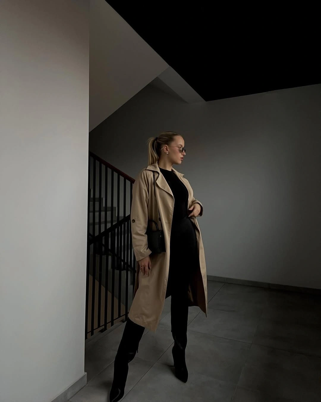 Trench coat fall outfits 2026 + Beige Trench With All-Black Layers And Tall Boots