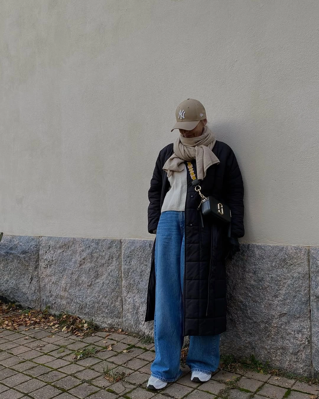 wide leg jeans outfit fall 2026 + Long Black Puffer Layers with Sneakers and Wide-Leg Denim