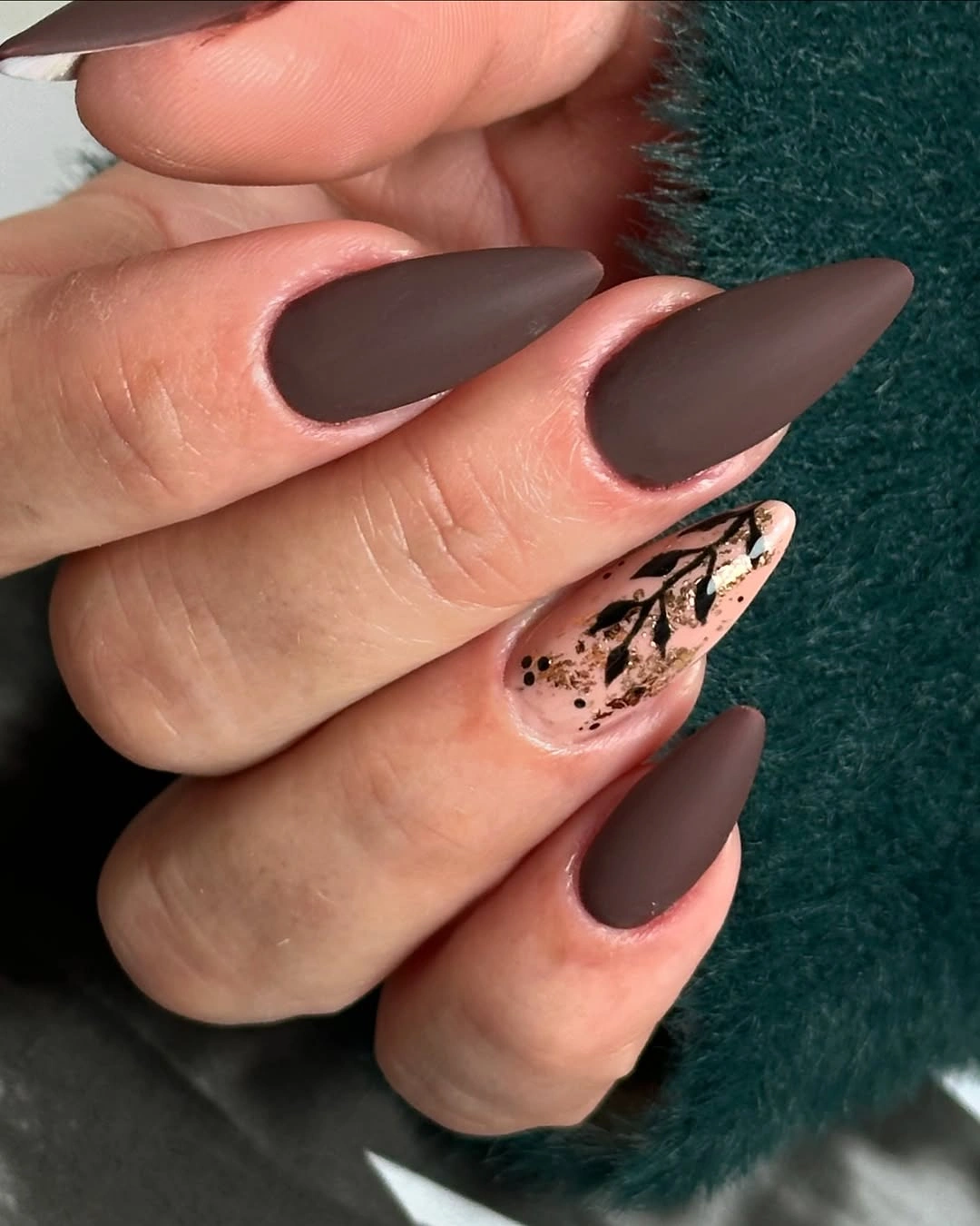 Very long chocolate matte almond nails with one graphic accent