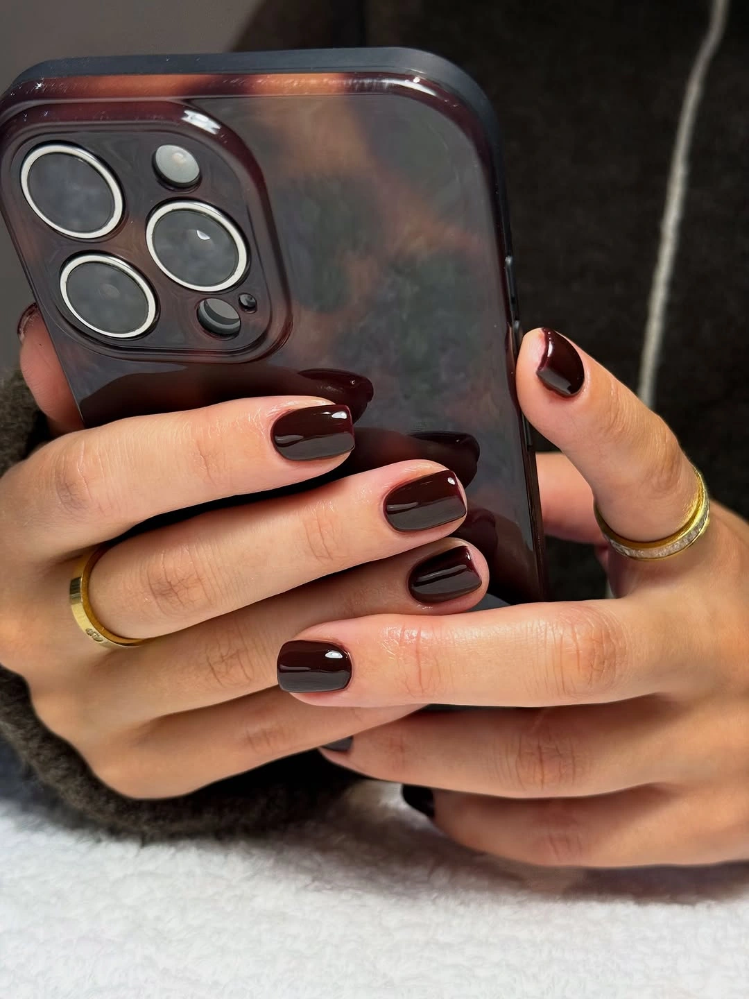 Short square nails in a deep glossy burgundy shade