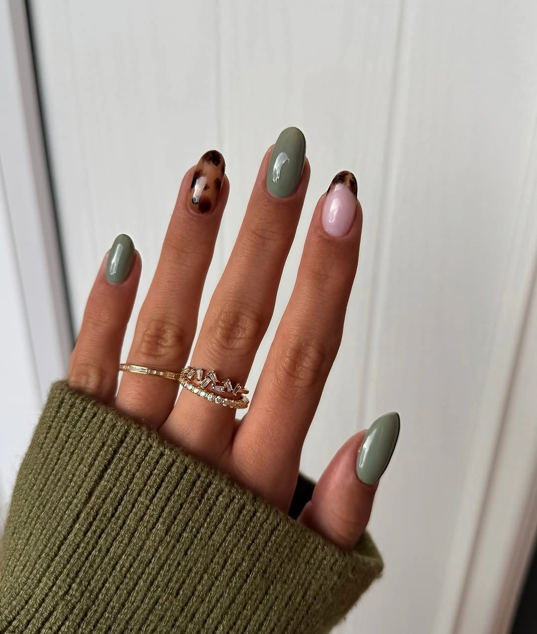Medium almond nails with olive pink and brown accents