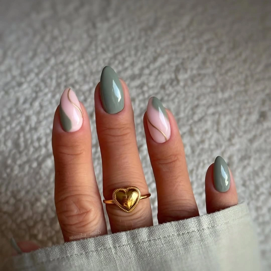 Medium almond nails with pale pink sage and blue green accents
