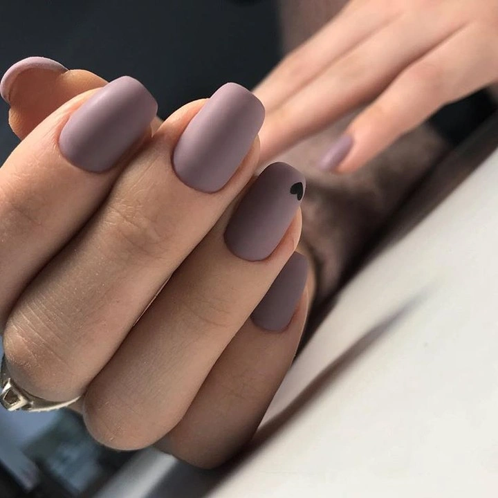 Medium almond nails in a muted lavender matte color
