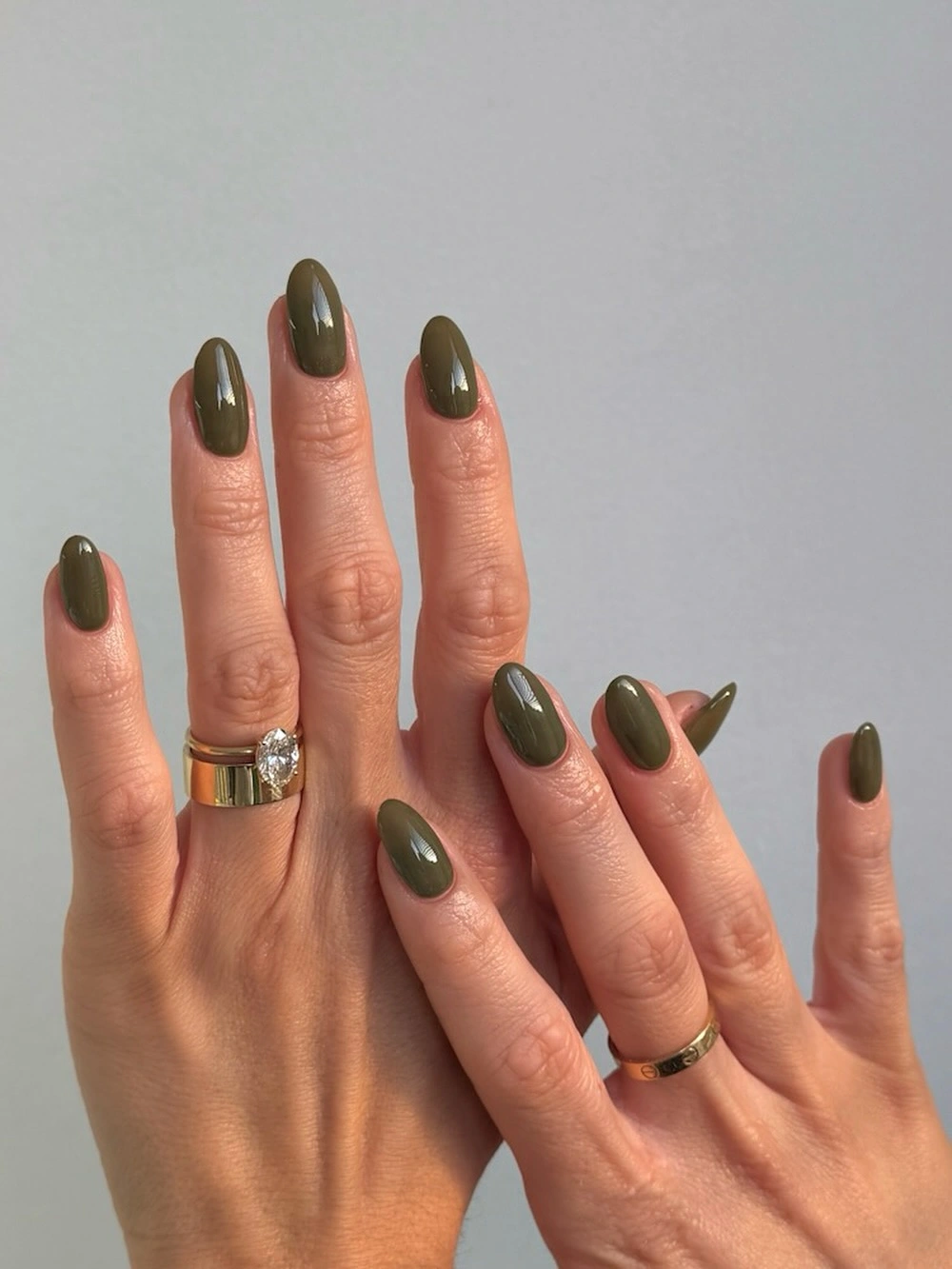 deep olive-green oval nails with glossy finish