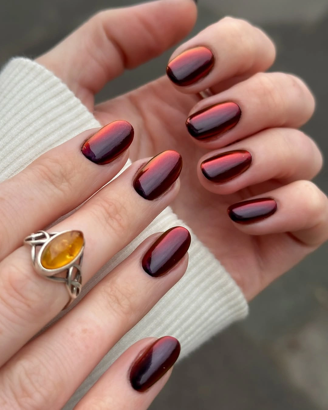 burgundy and nude almond nails with spotted tips