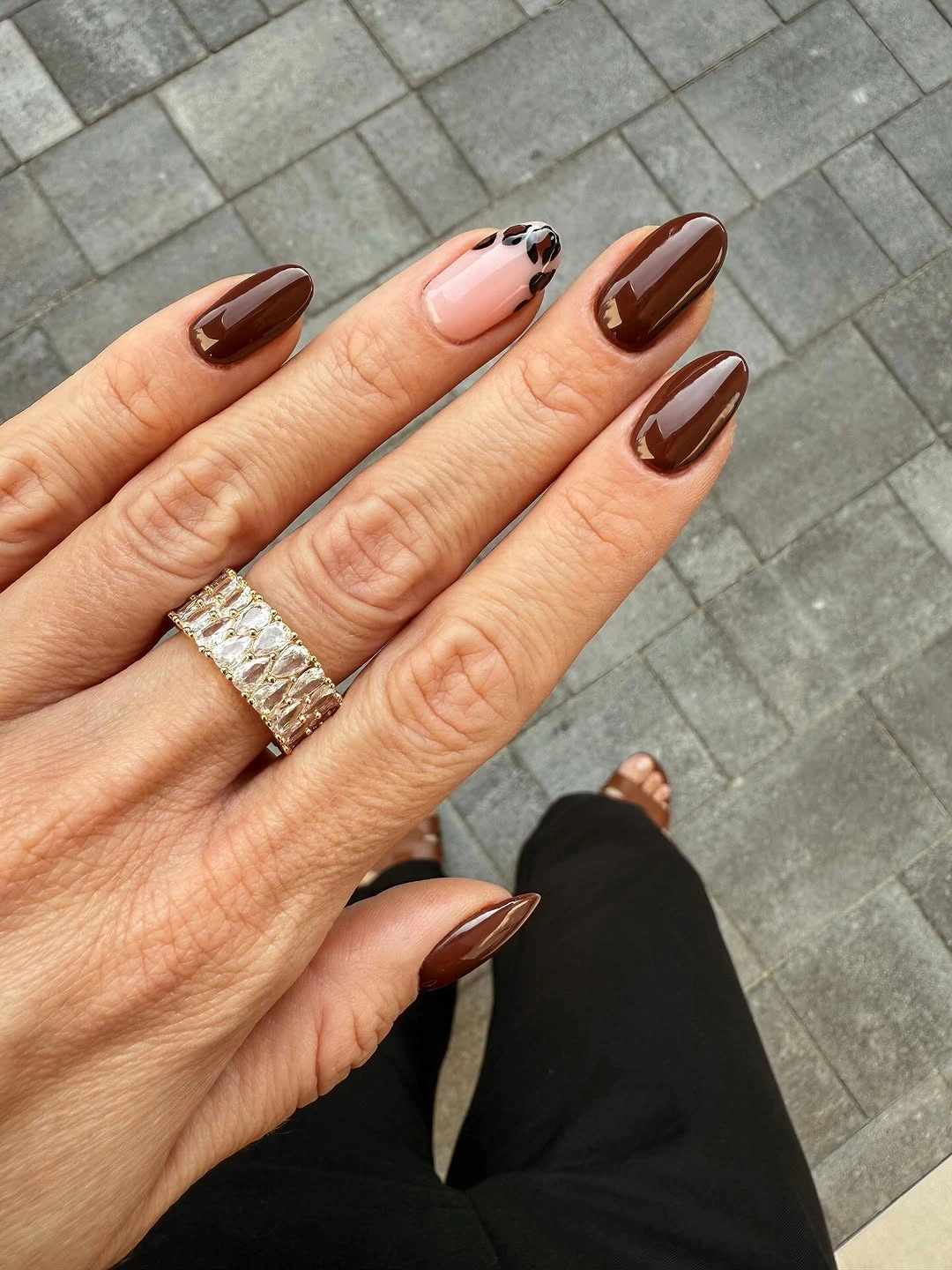 glossy chocolate almond nails with one pale outlined accent