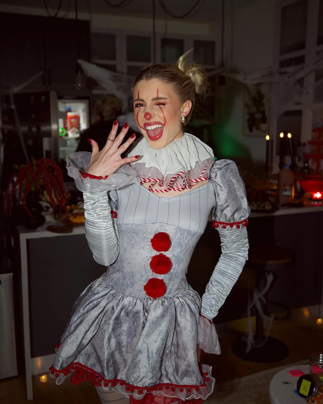 pale gray outfit with puffed sleeves, fitted bodice, gathered short skirt, and high collar