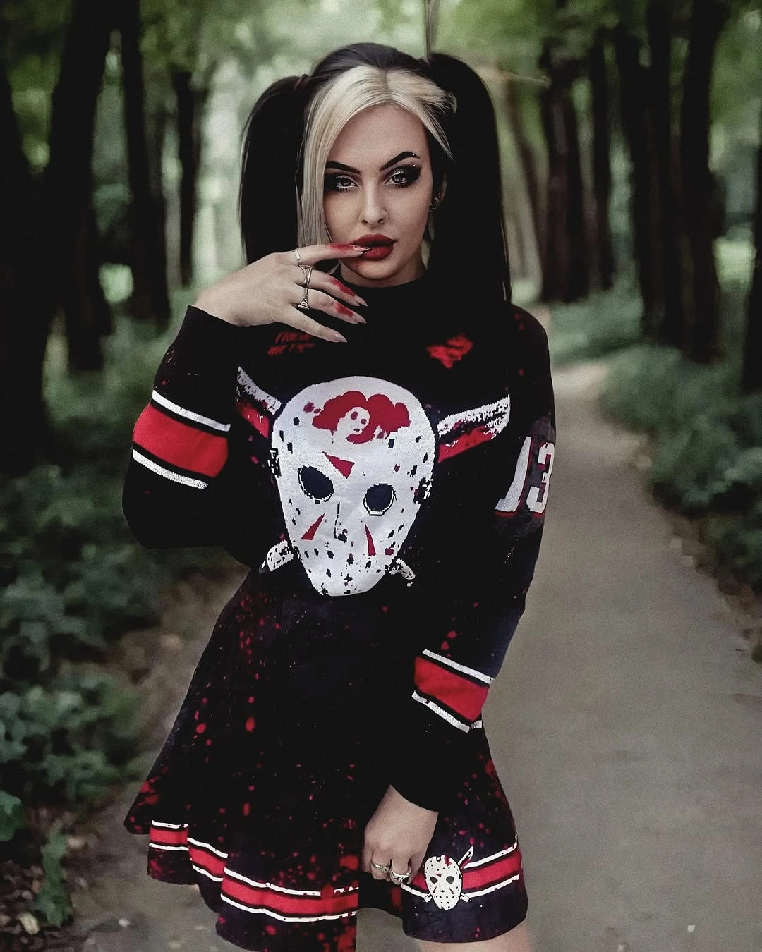 black outfit with fitted long-sleeve bodice with flared short skirt