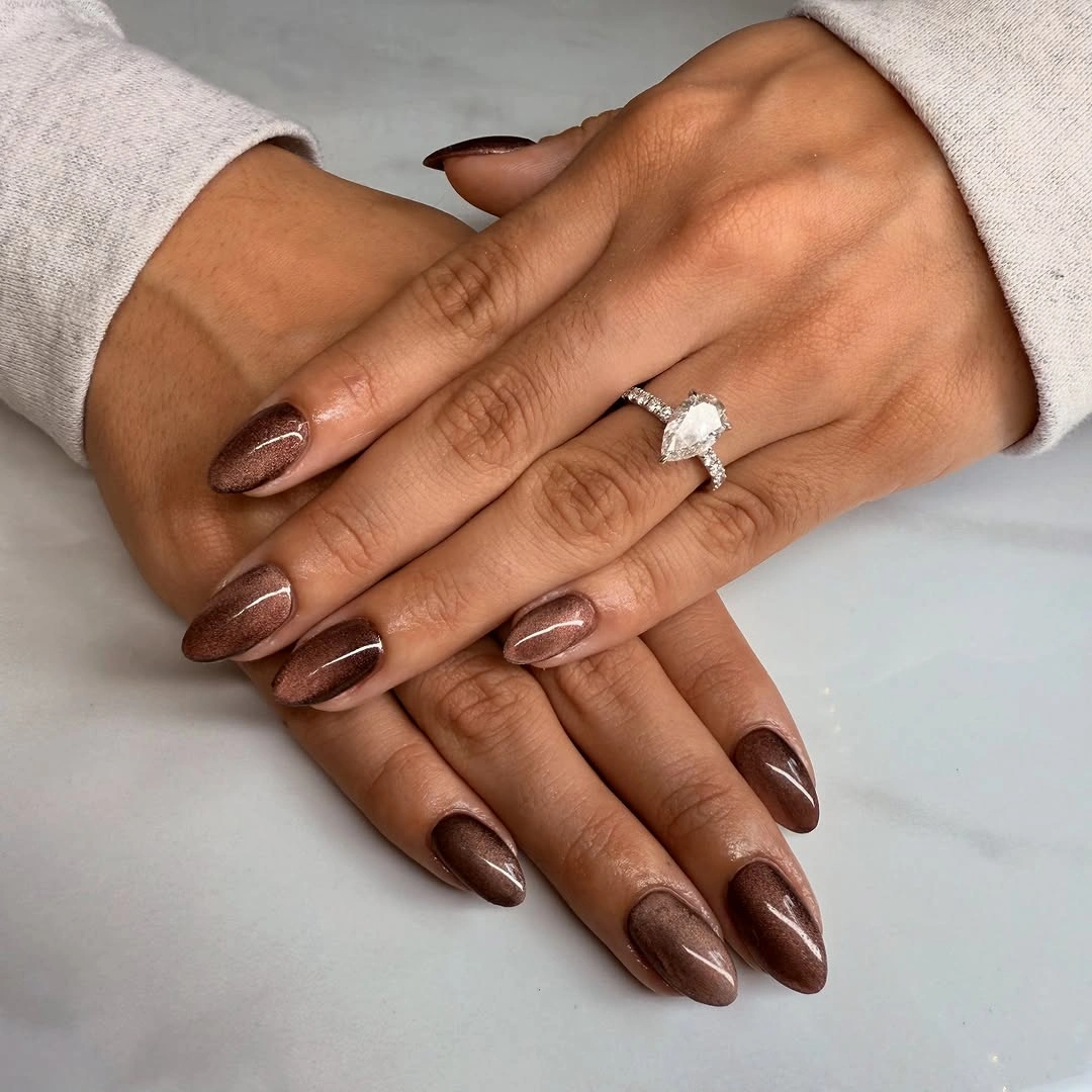 long brown almond nails with fine rose gold shimmer