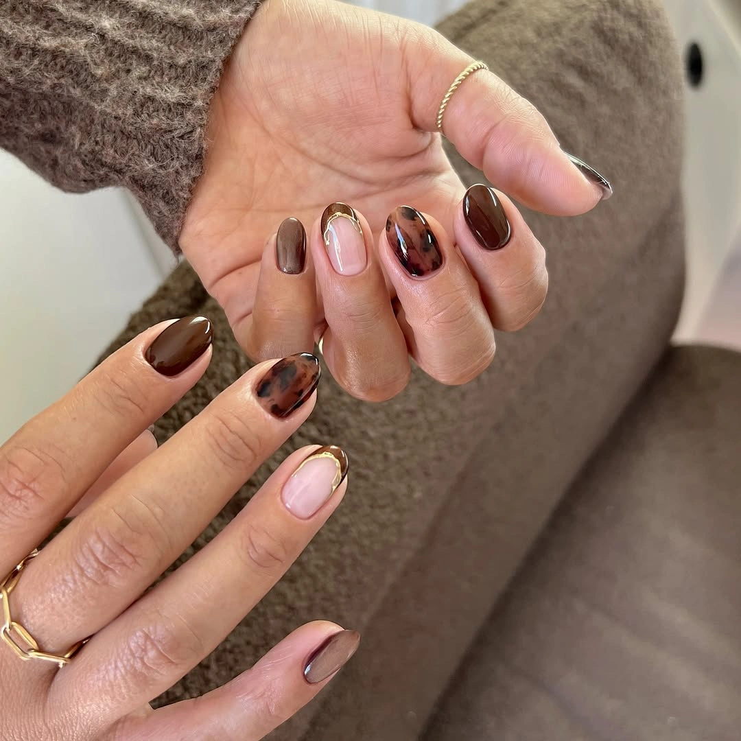 medium almond nails with espresso and tortoiseshell accents