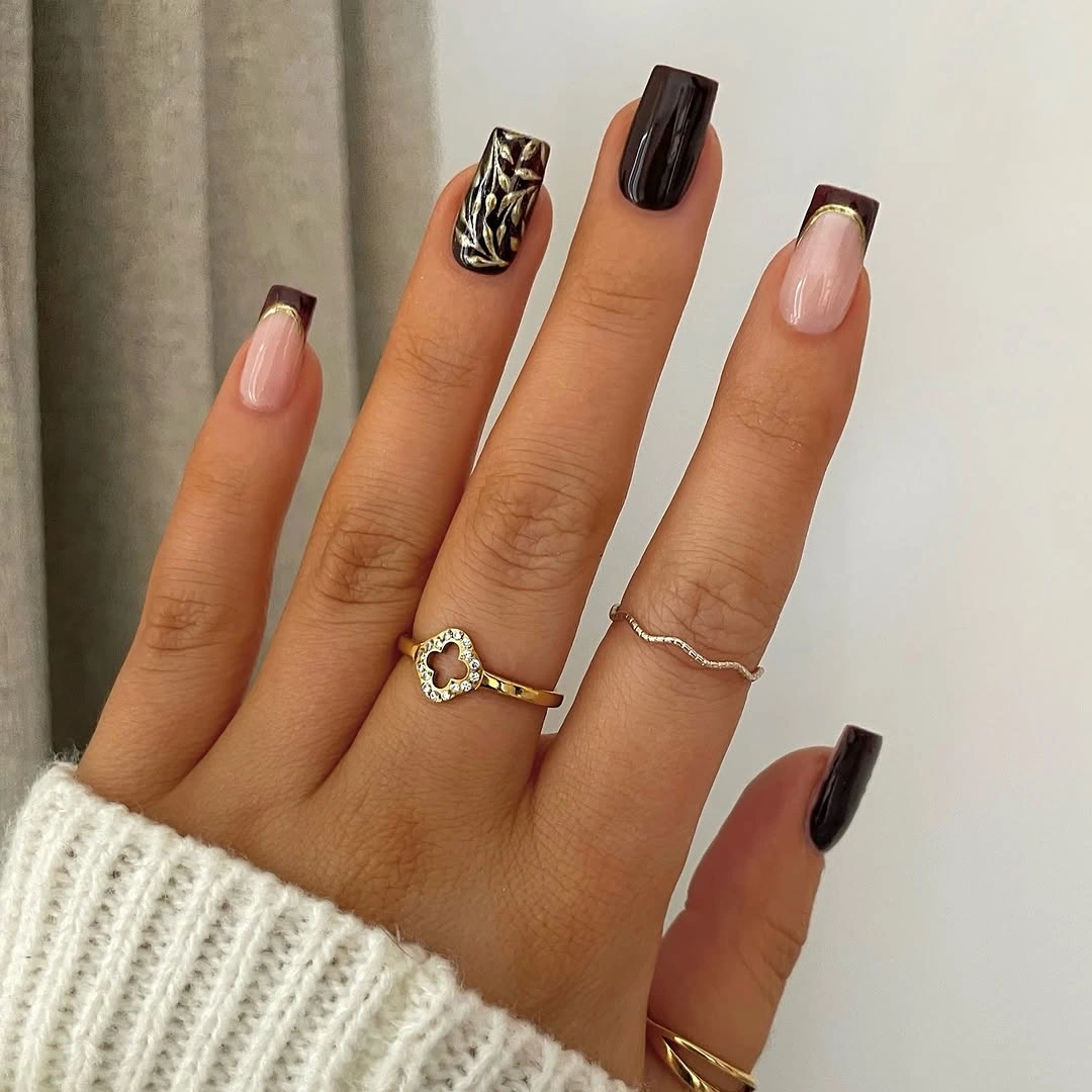 medium square nails with black nude and gold accents