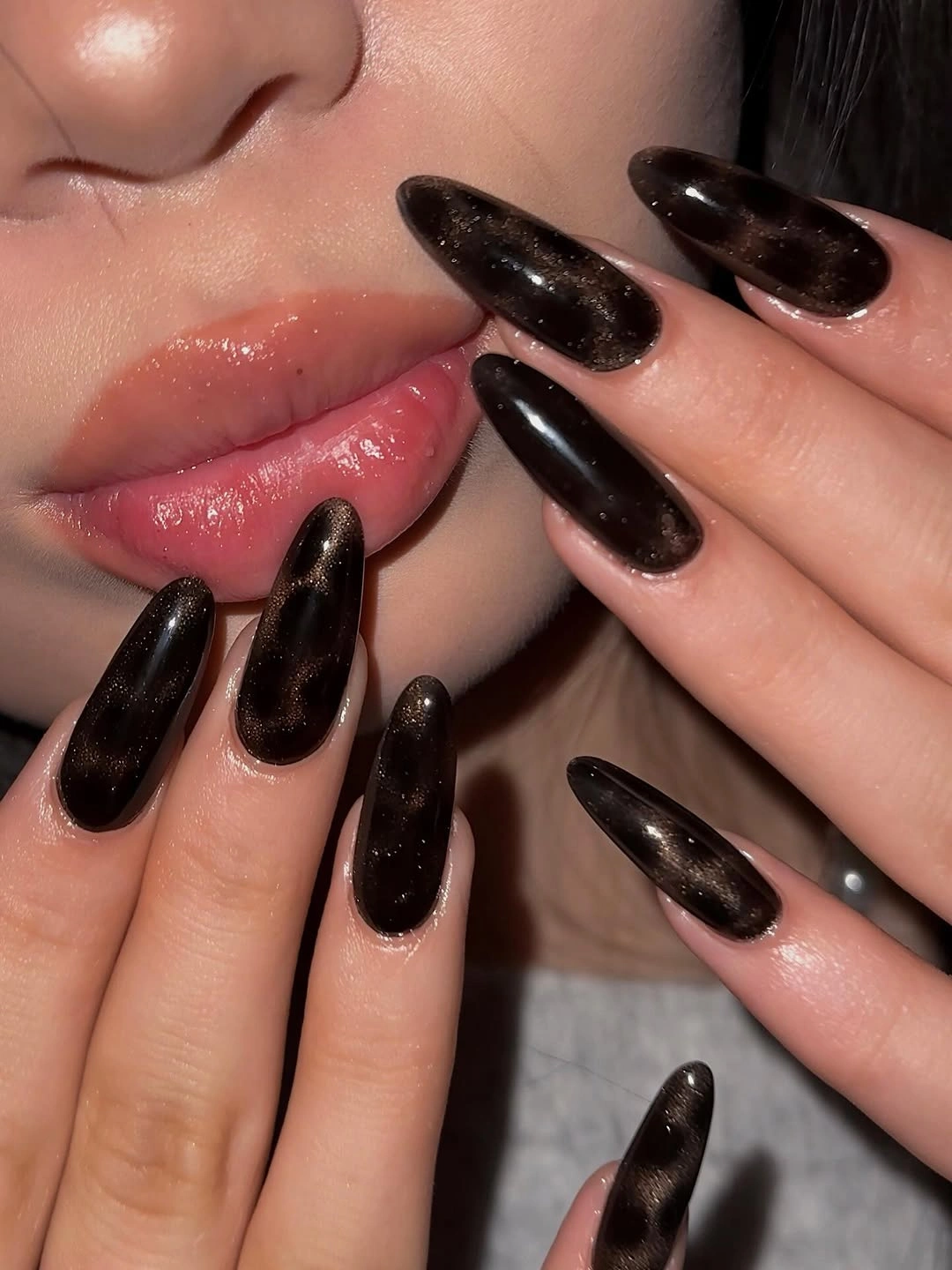long almond nails with black brown reflective shine