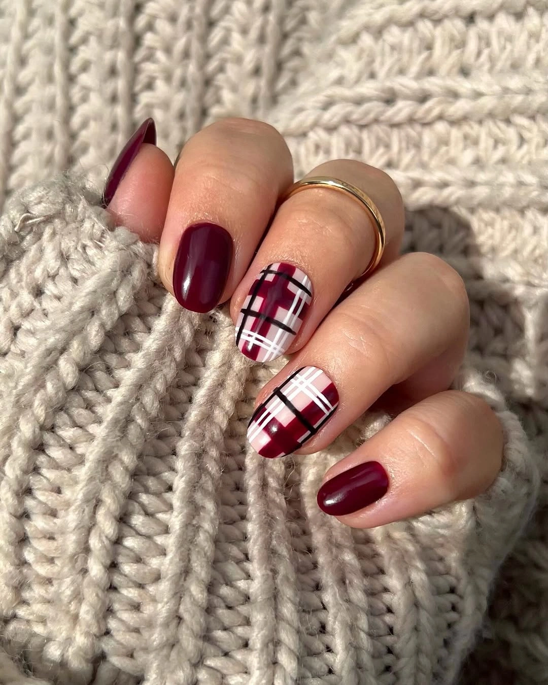 Medium square burgundy nails with cream plaid accent