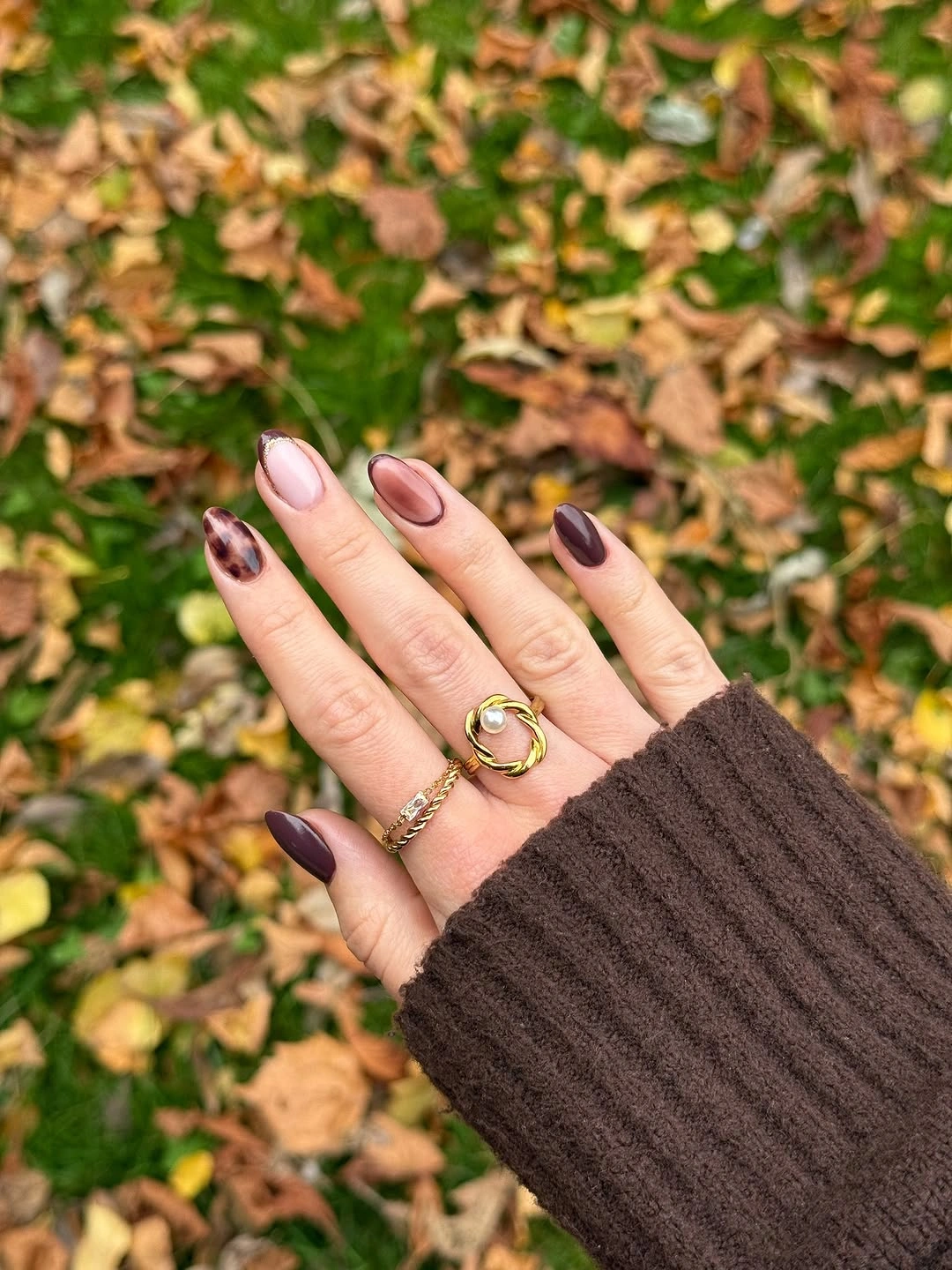 Soft pink almond nails with dark fall tips