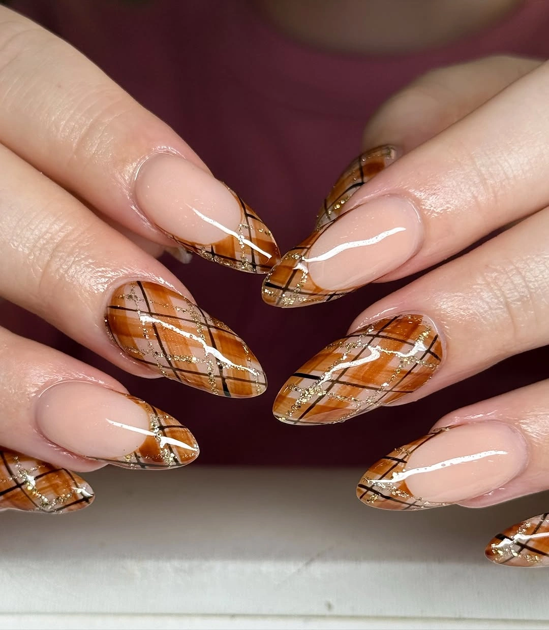 Orange plaid French tip almond nails