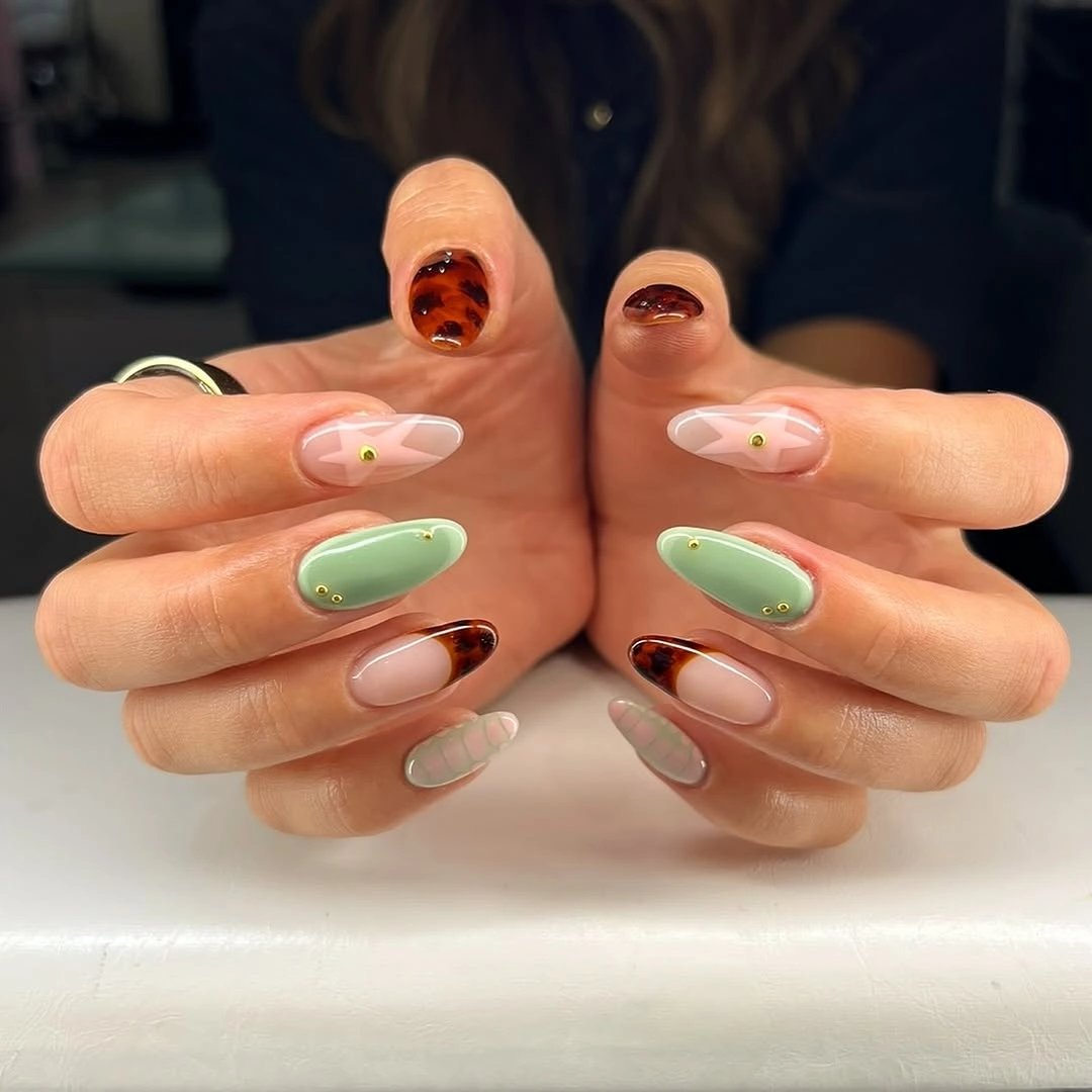 Mint green nails with tiny fall accents