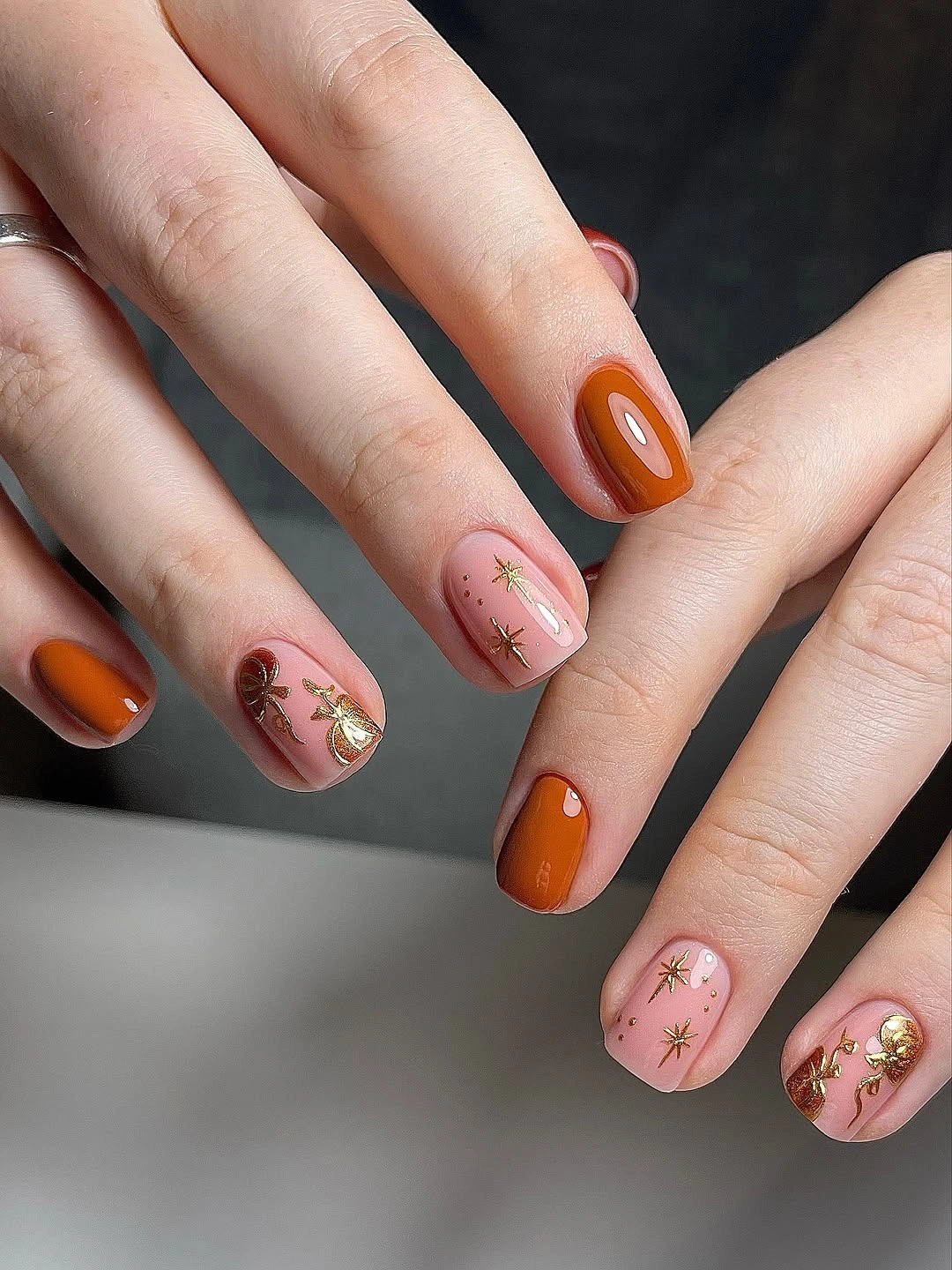 Burnt orange blush nails with gold accents
